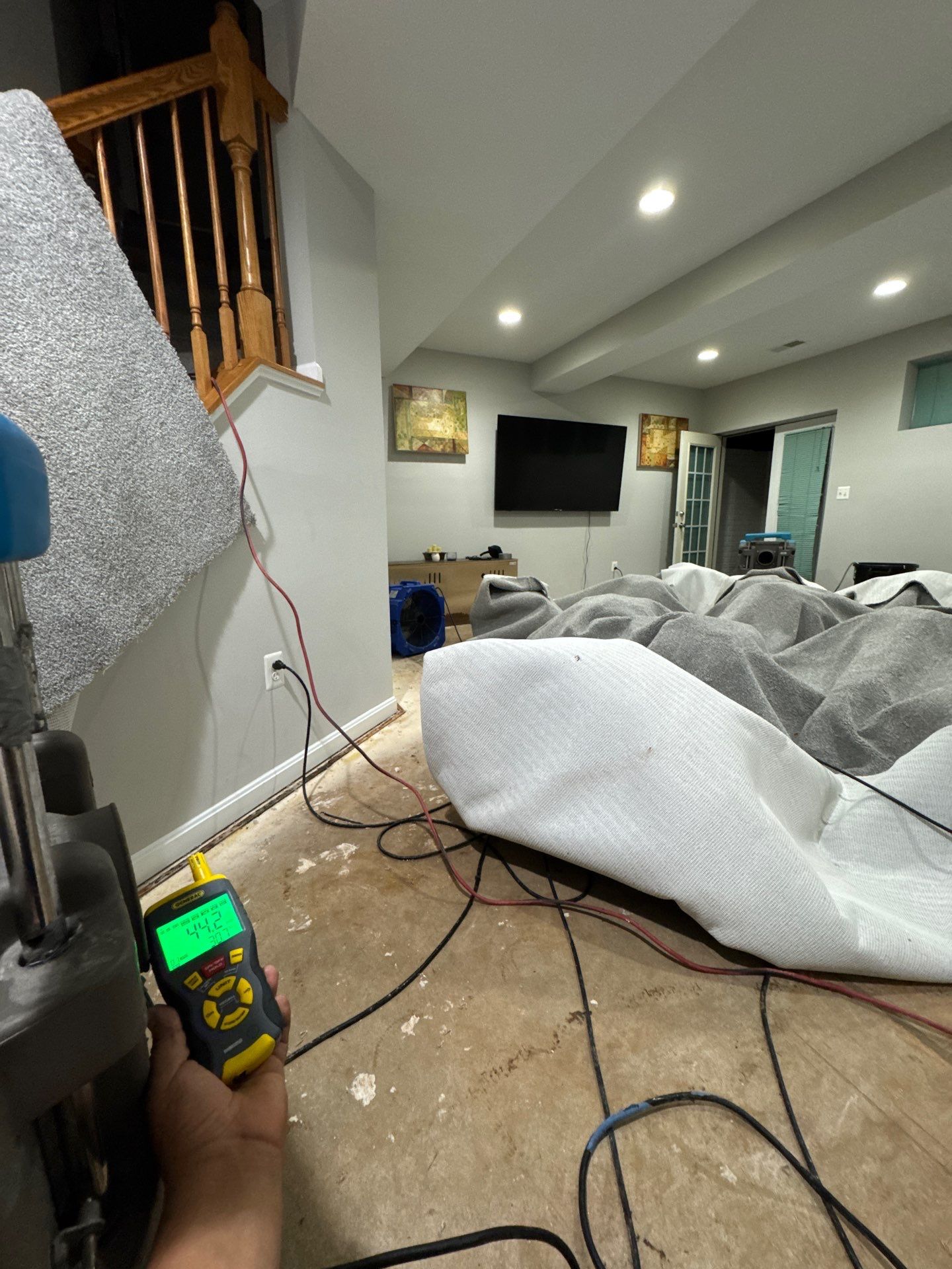 Continued dehumidification monitoring moisture levels as drying progresses through the restoration.