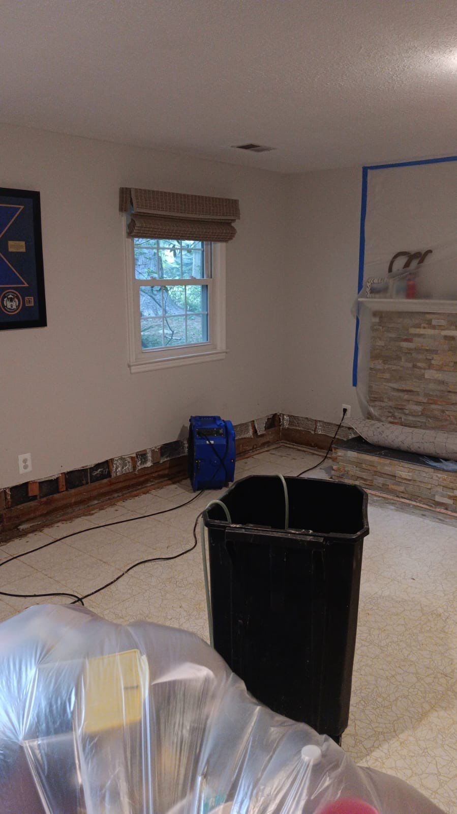 Dehumidification setup continuing structural drying phase of water damage restoration work.