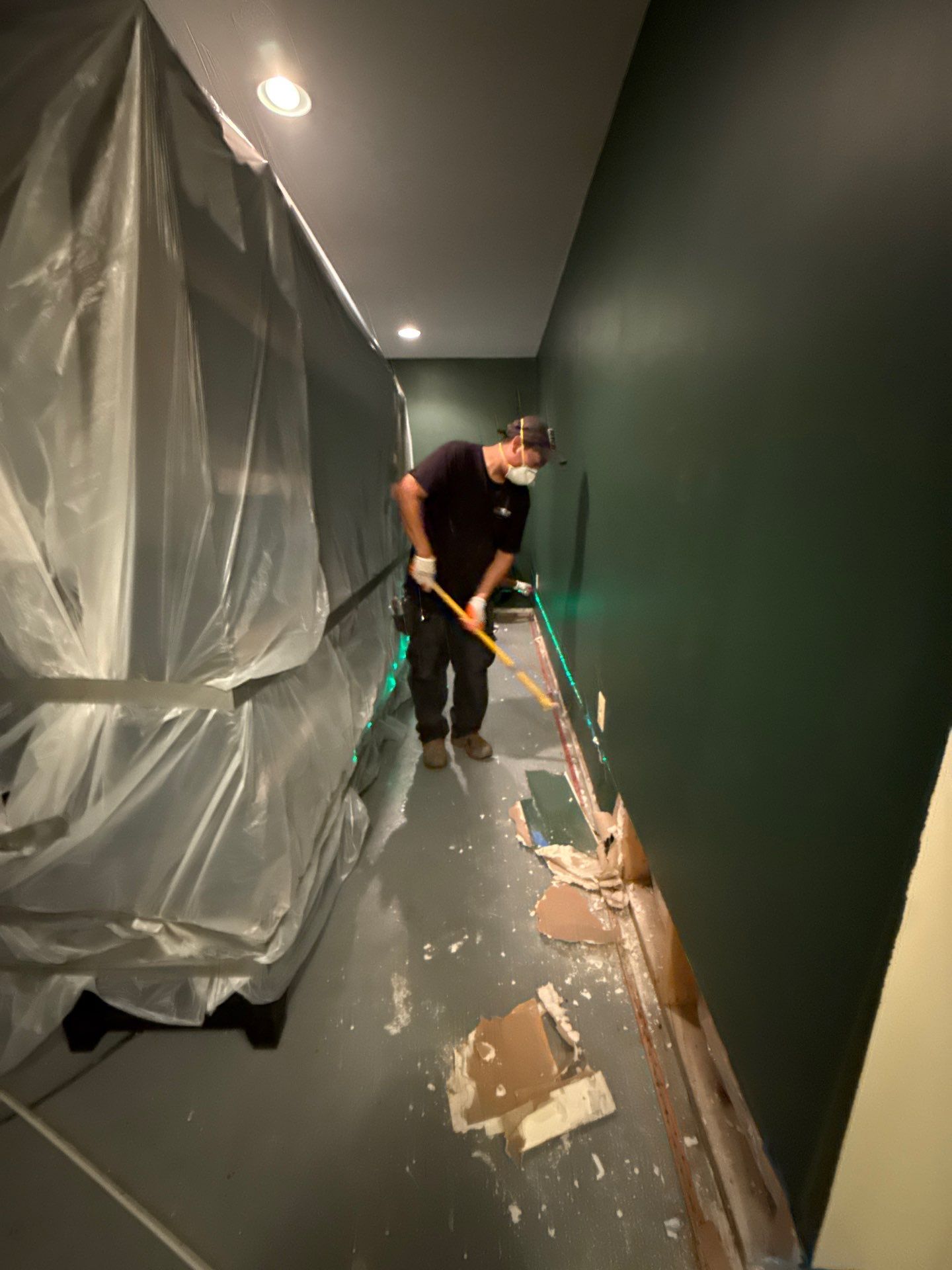 Structural drying phase with dehumidification equipment positioned to remove residual moisture from framing and subfloor.