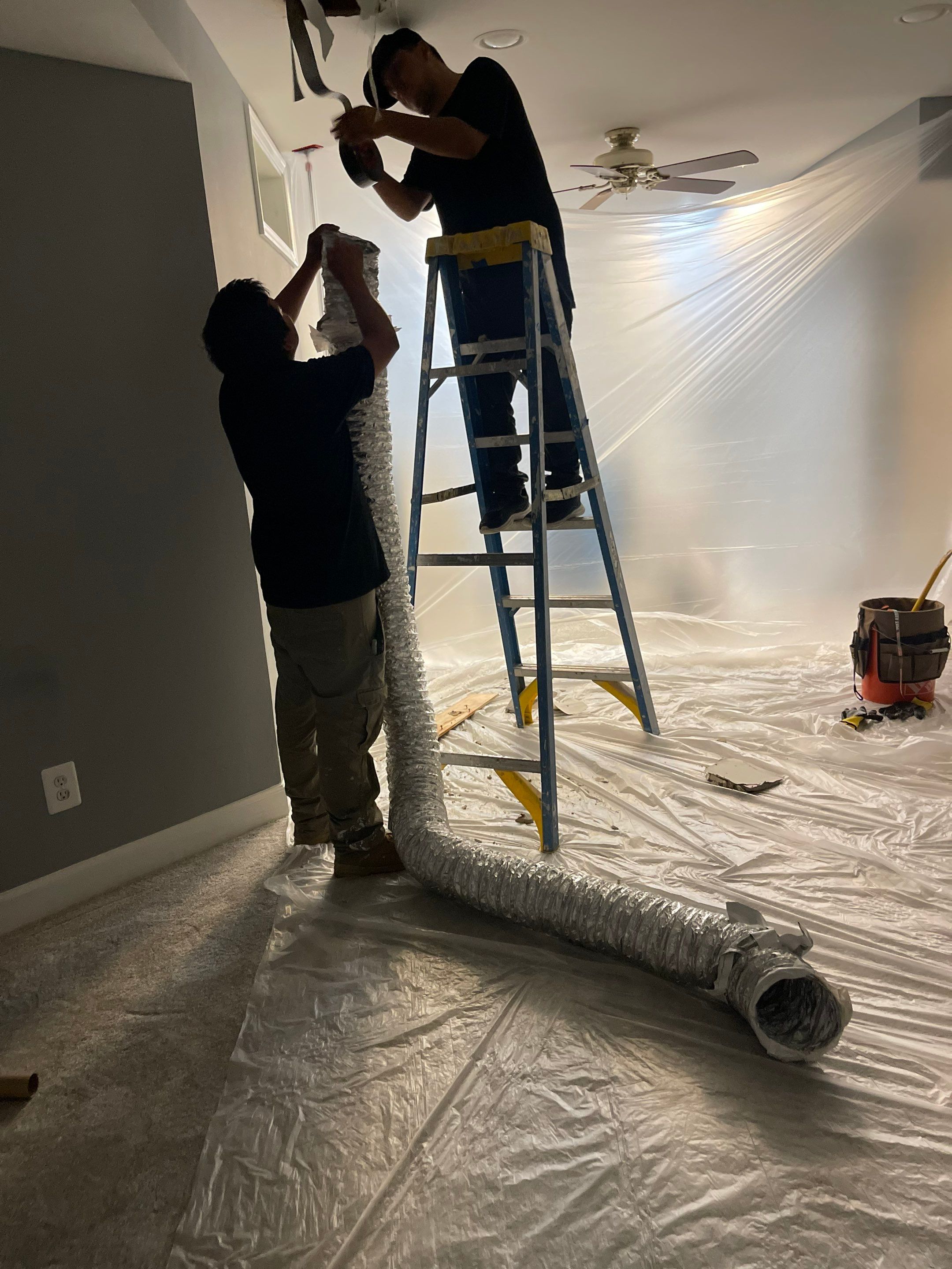 Mid-stage drying progress showing moisture remediation in Woodbridge water damage restoration.