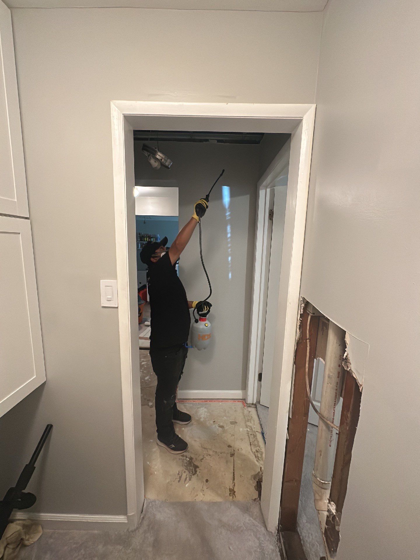 Dehumidification equipment positioned for structural drying after water intrusion.