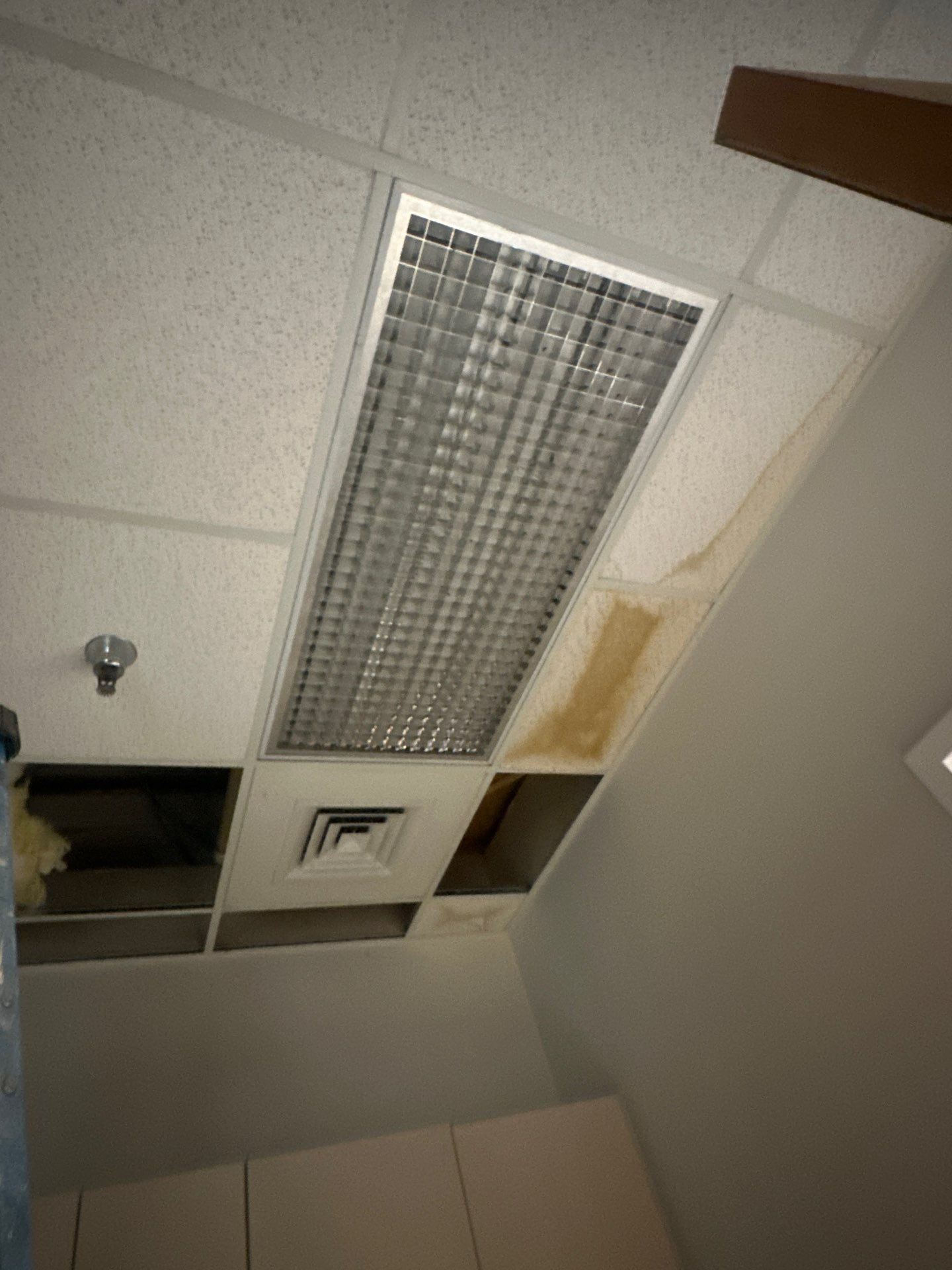 Dehumidification equipment positioned for structural drying during moisture remediation.