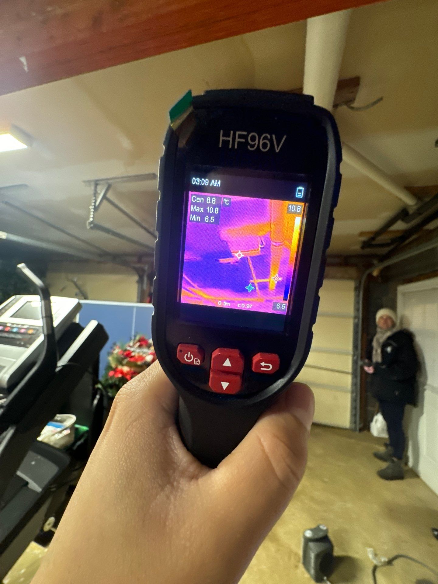 Thermal imaging camera detecting moisture patterns during water damage inspection in Vienna.