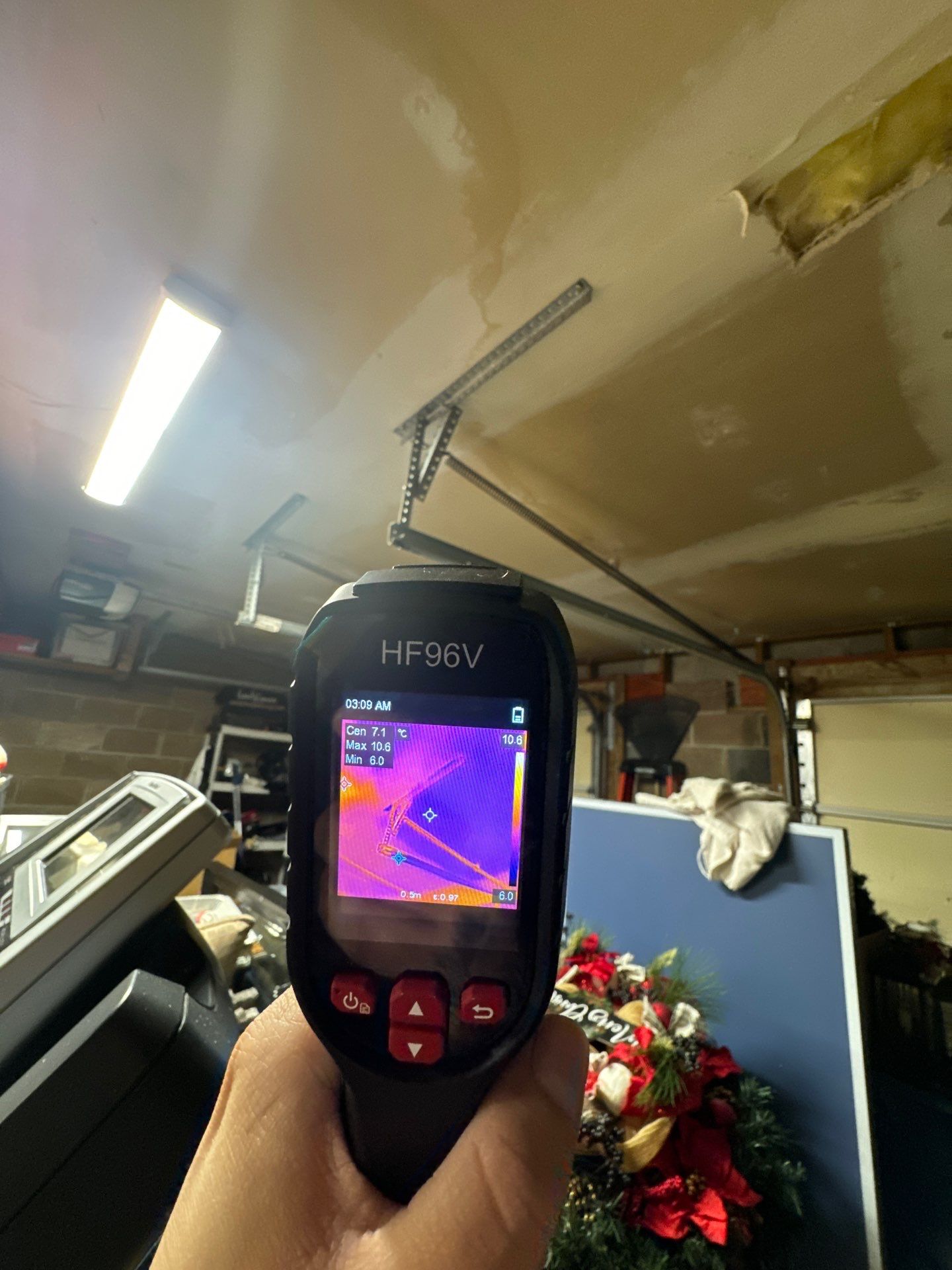 Thermal image revealing hidden moisture distribution across wall and framing.