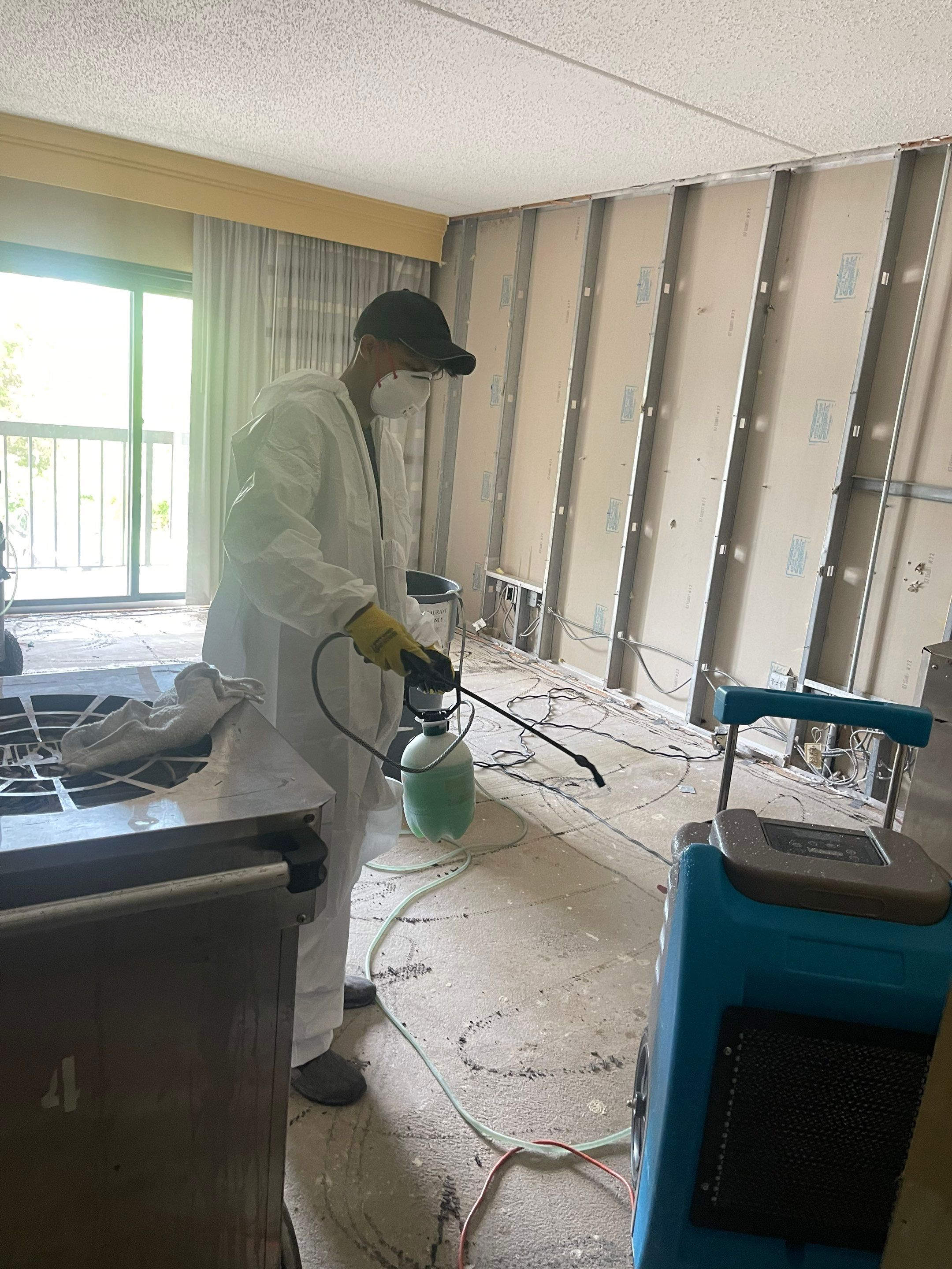 Final-stage water damage restoration in Manassas showing cleared space and completion of structural drying.