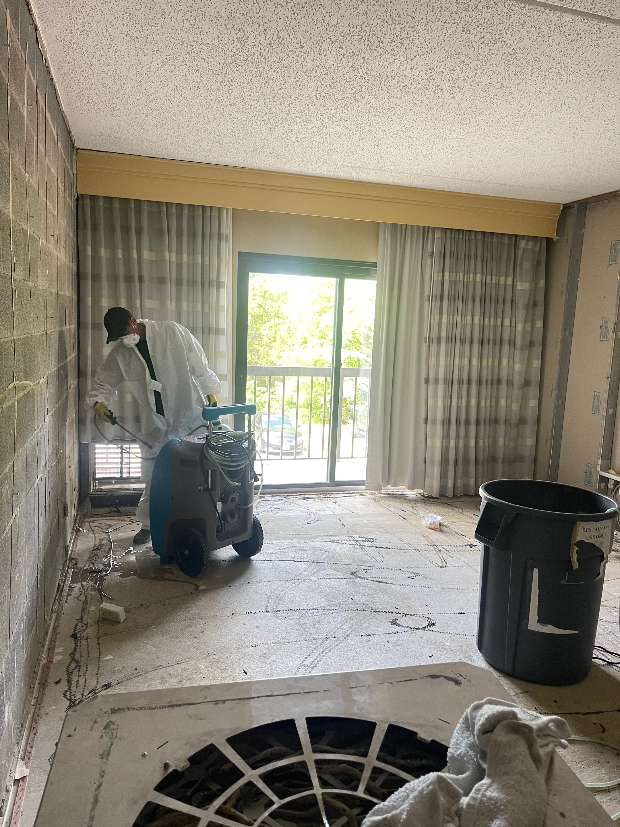 Moisture monitoring and equipment adjustment during mid-stage drying phase of water damage restoration.