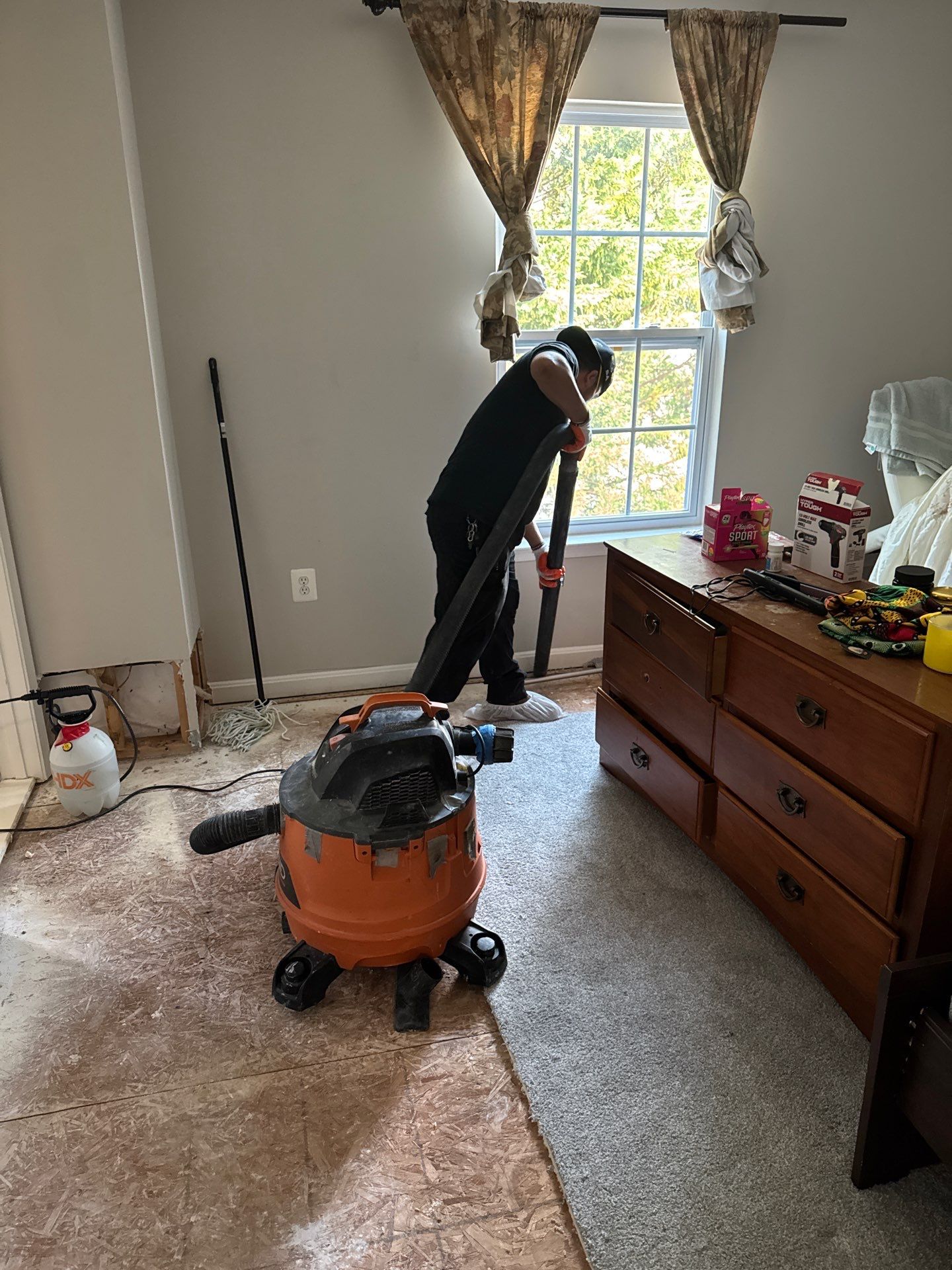 Wet drywall and structural materials exposed after water extraction in Chantilly restoration.