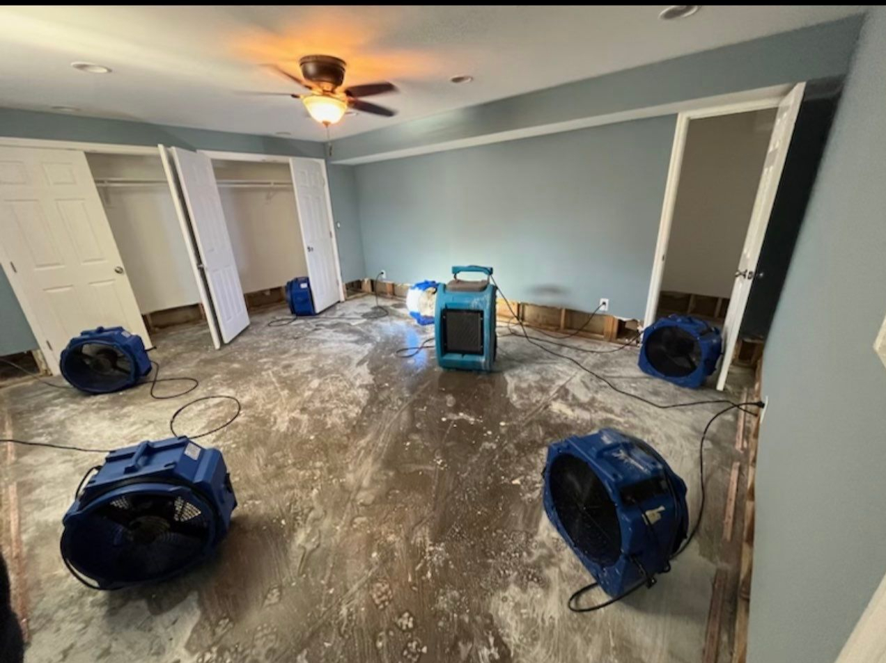 Dehumidification equipment positioned throughout affected area to manage moisture during structural drying process.
