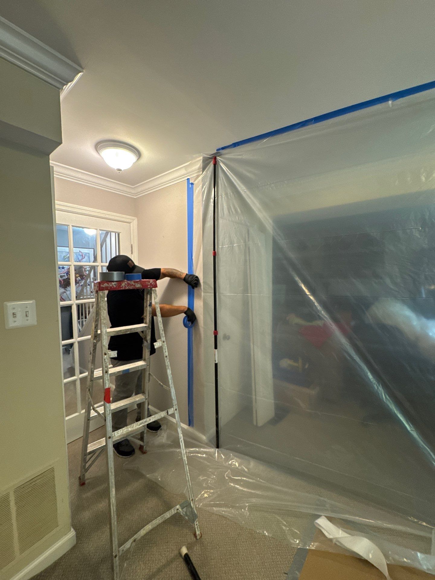 Containment barrier removed after mold remediation completion in Reston, Virginia.