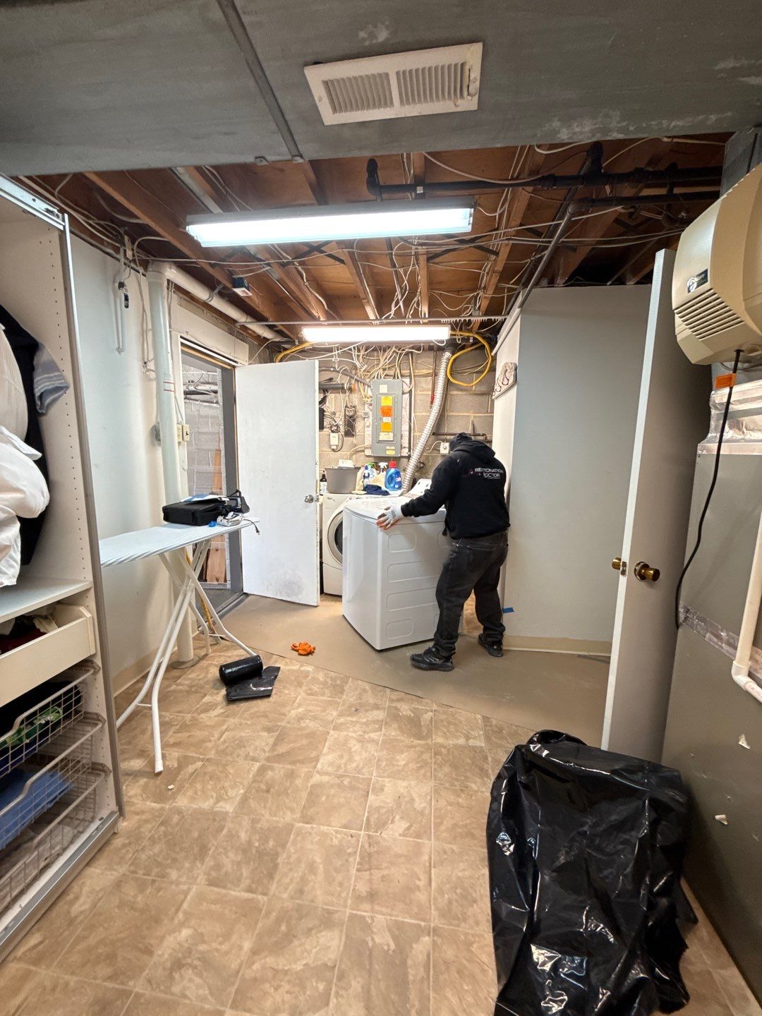Ceiling damage assessment and preparation for repair during active drying phase of remediation.