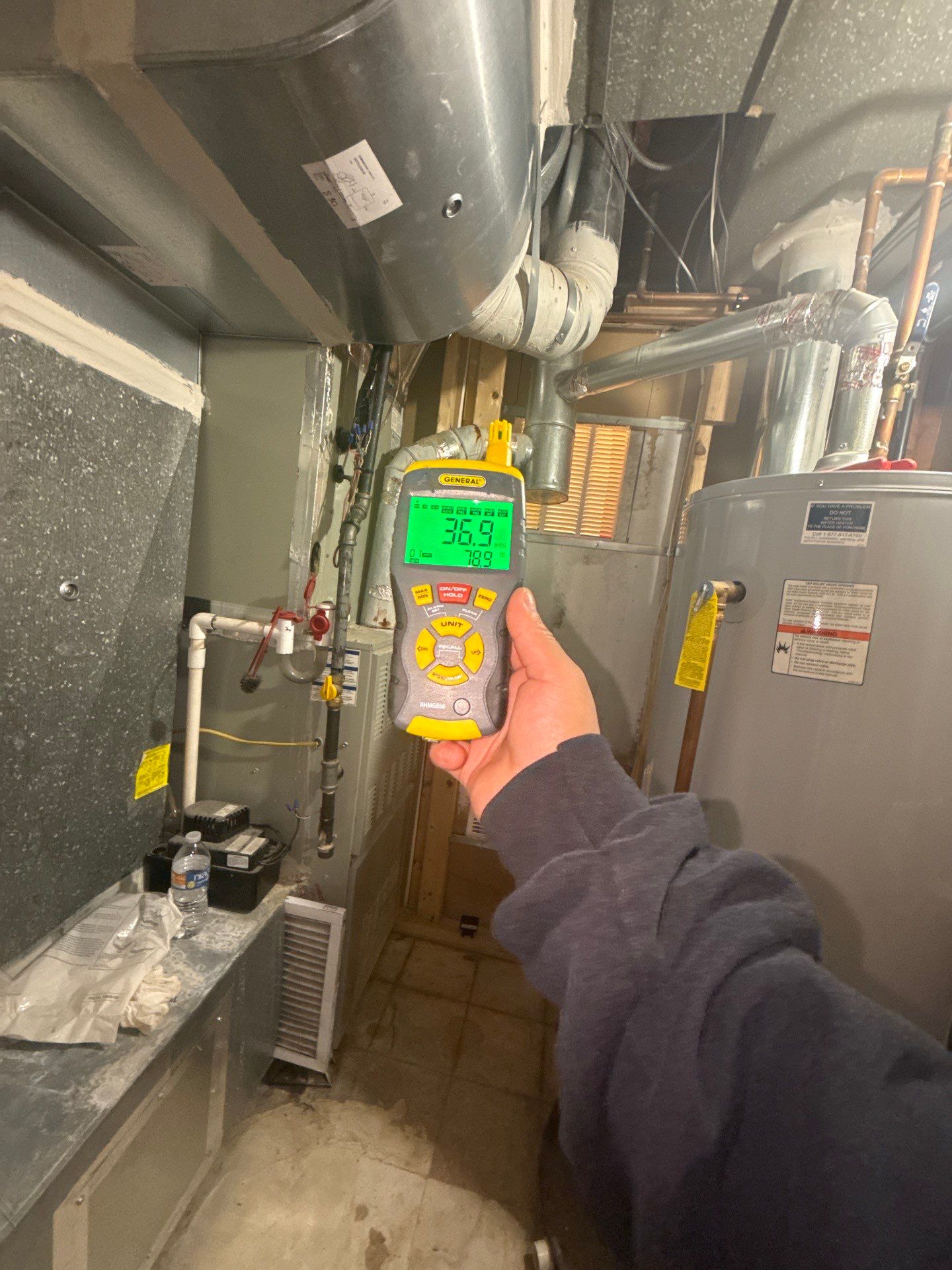 Dehumidification and air movement equipment operating within sealed containment during mid-stage water restoration.