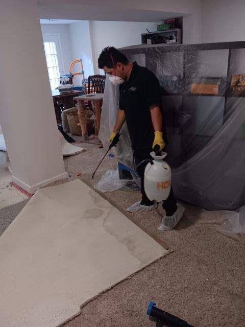 Wet carpet removal and pad extraction as part of water damage restoration process.