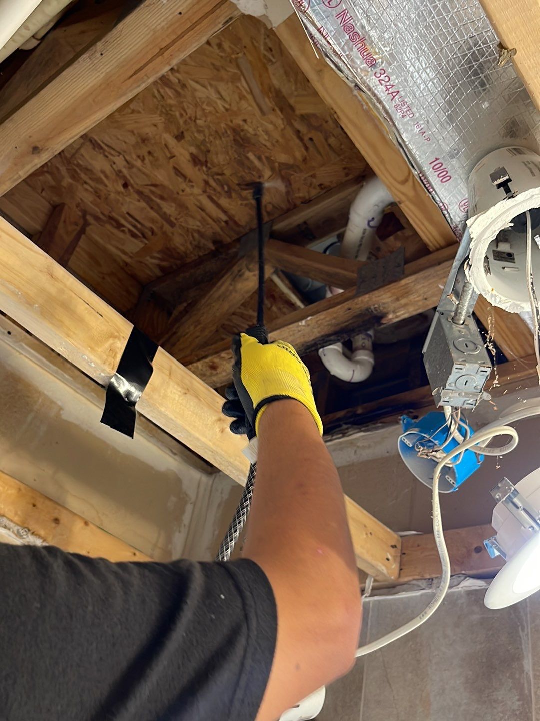 Standing water extraction underway in Falls Church water damage restoration, initial assessment phase.