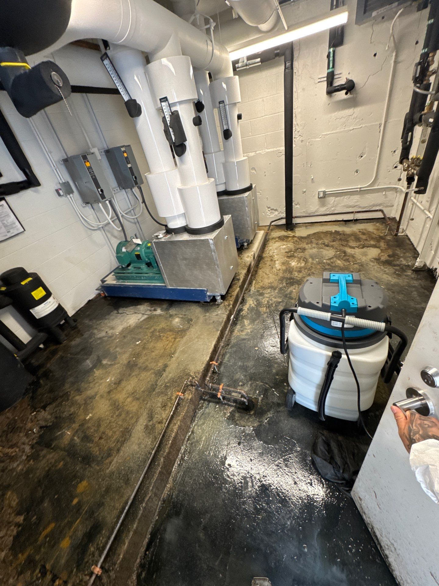 Final structural drying phase of Arlington water restoration, equipment removal and moisture verification complete.