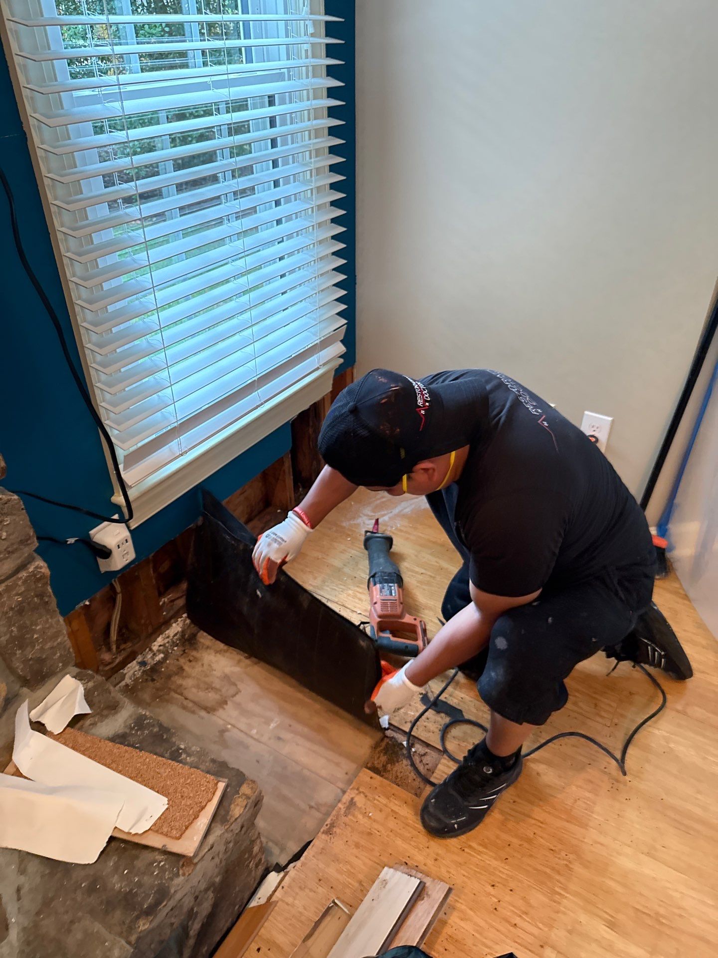 Containment barrier erected around affected wall cavity during mold remediation in Leesburg.