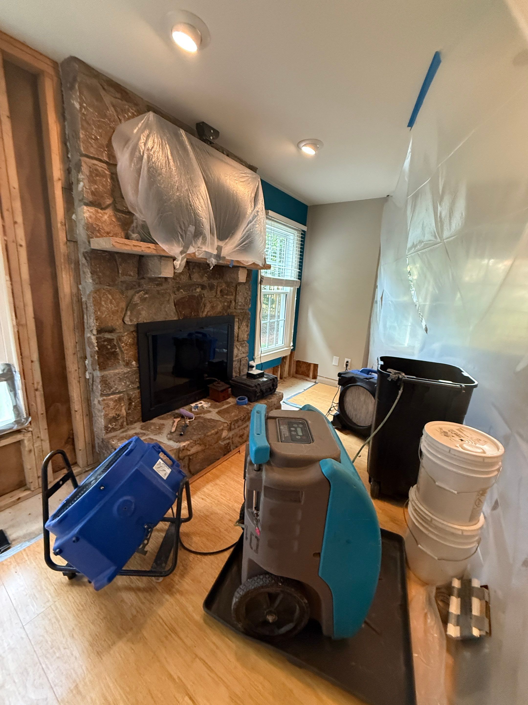 Continued moisture extraction and air management within sealed work area.