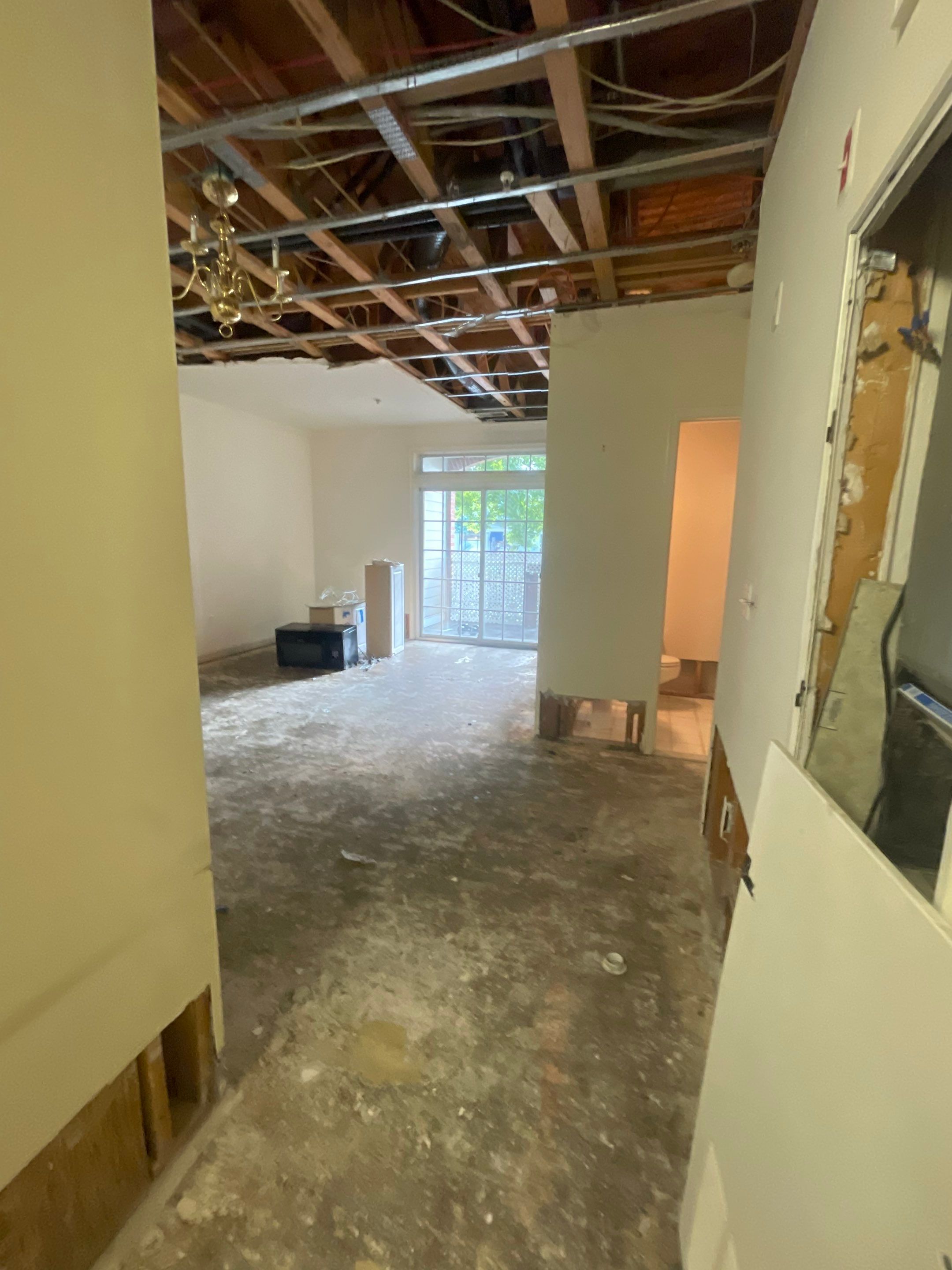 Water damage restoration in Vienna showing initial assessment with dehumidification equipment positioned for structural drying.