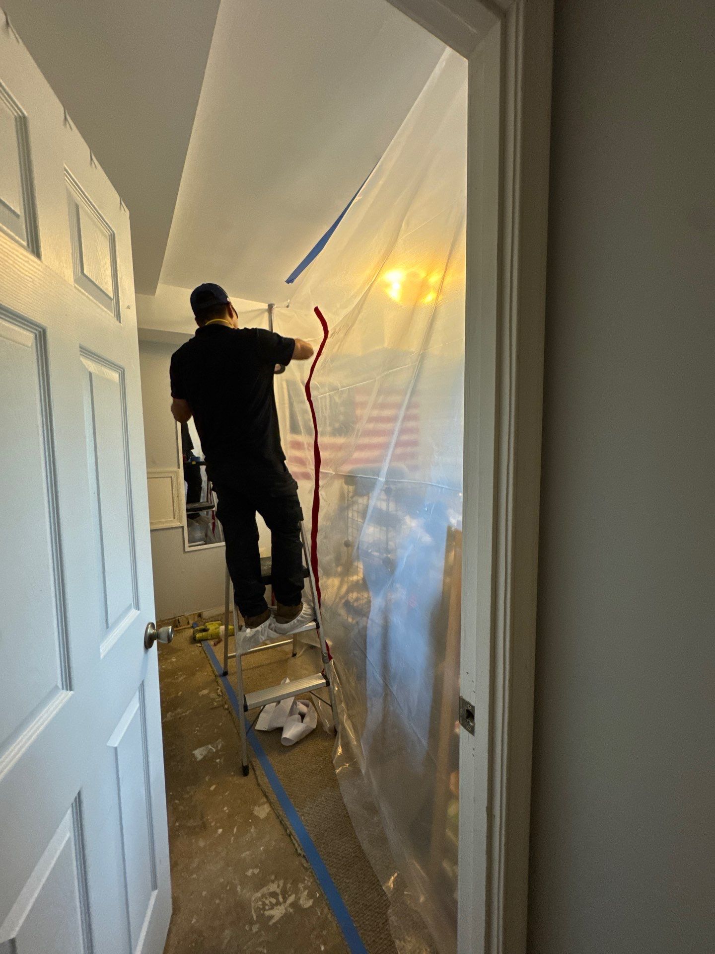 Flooring removal and preparation for remediation in McLean mold damage zone.