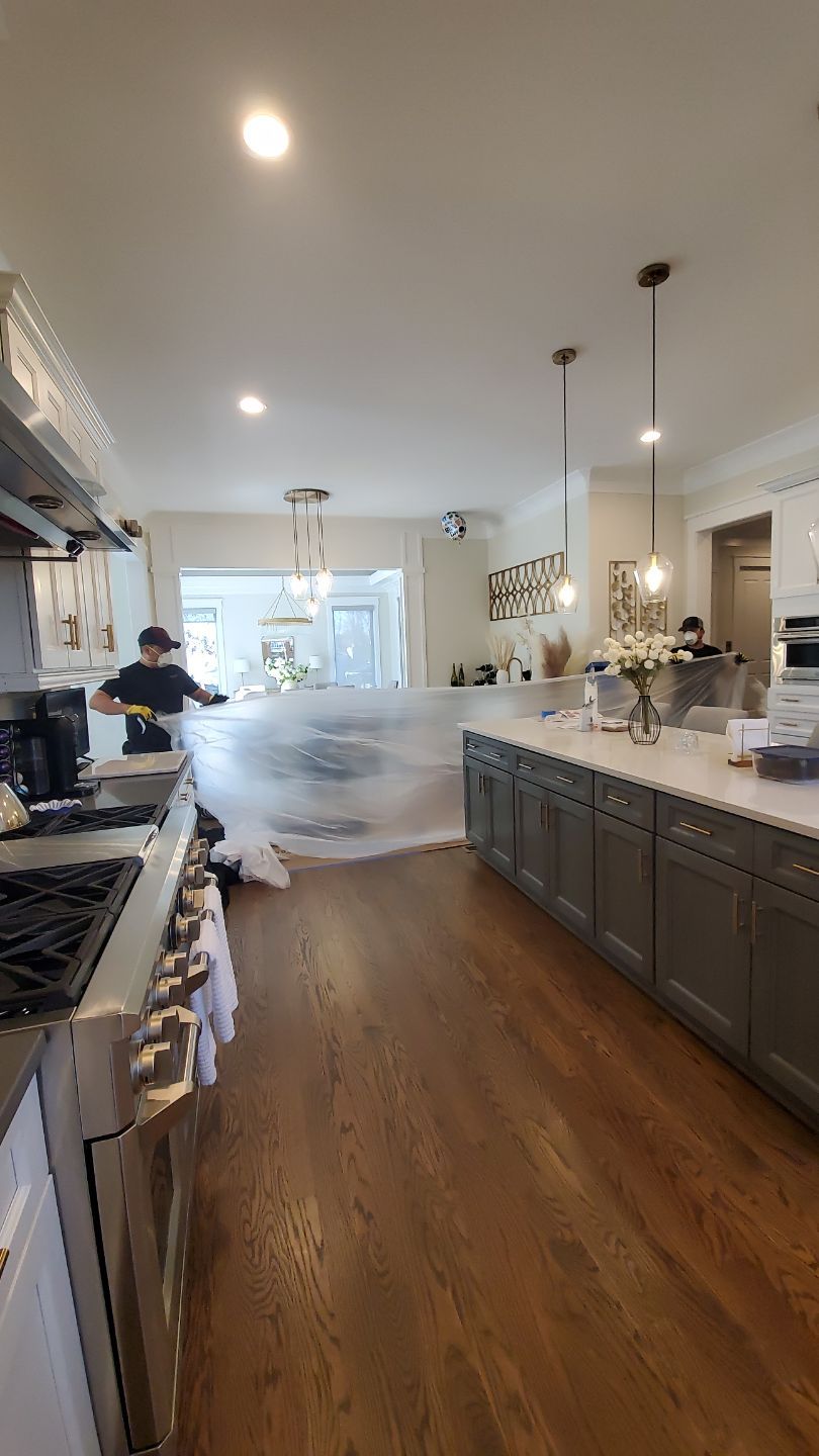 Mid-stage water damage restoration showing continued dehumidification and moisture extraction.