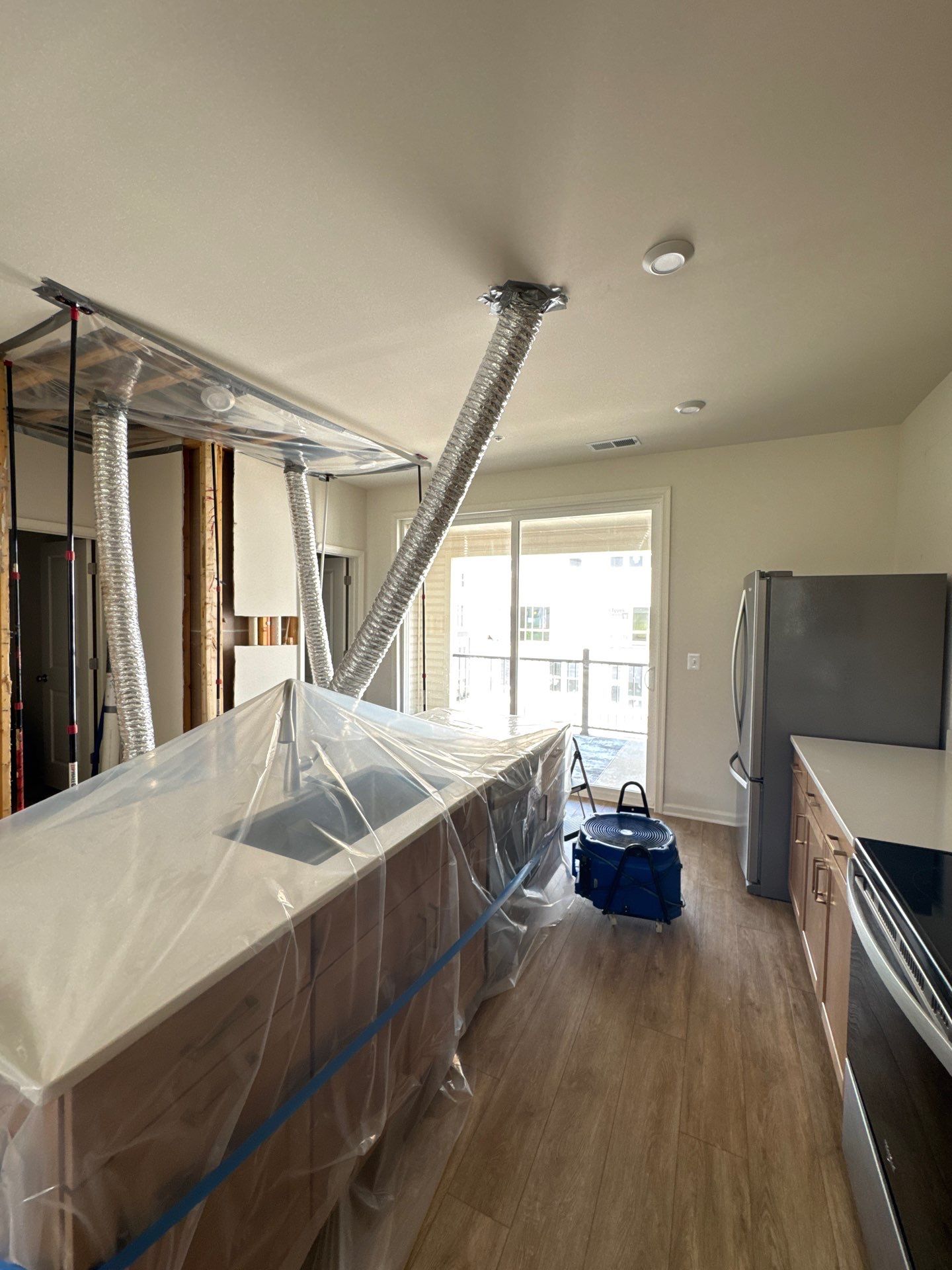 Completed water damage restoration in Woodbridge showing finished walls and restored interior surfaces.