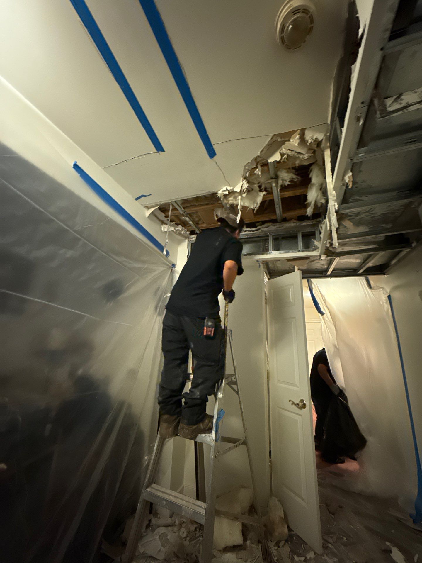 Standing water extraction underway during water damage restoration in Alexandria, Virginia.