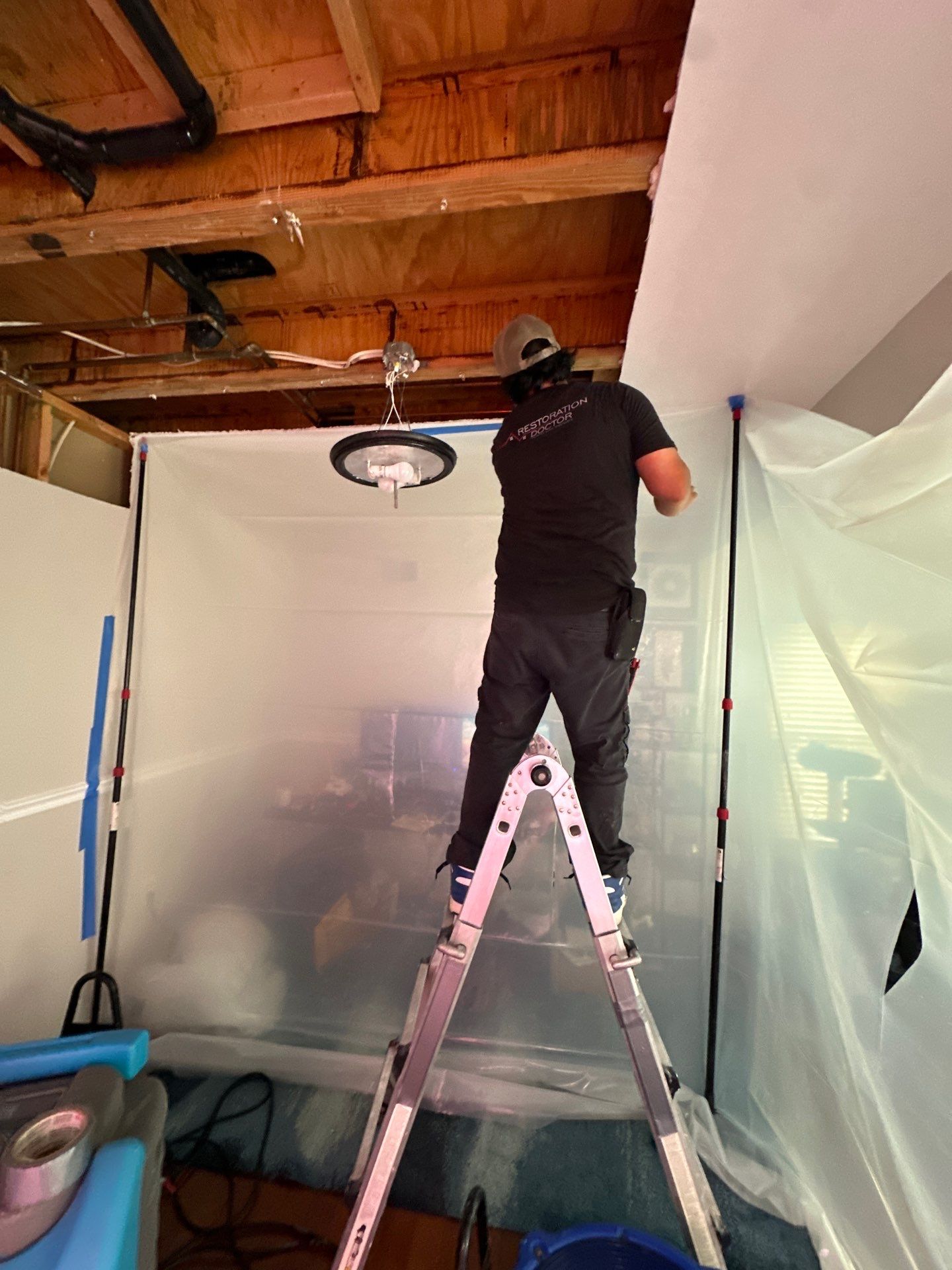 Dehumidification equipment positioned for structural drying during moisture remediation.