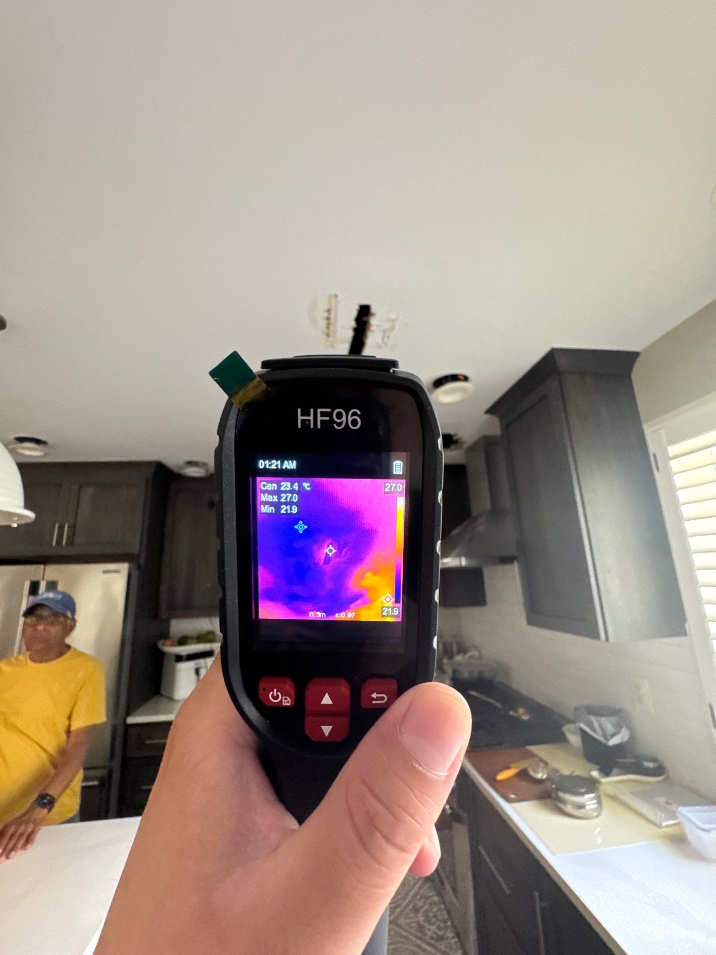 Thermal imaging reveals moisture distribution across ceiling cavity during water damage assessment in Herndon.