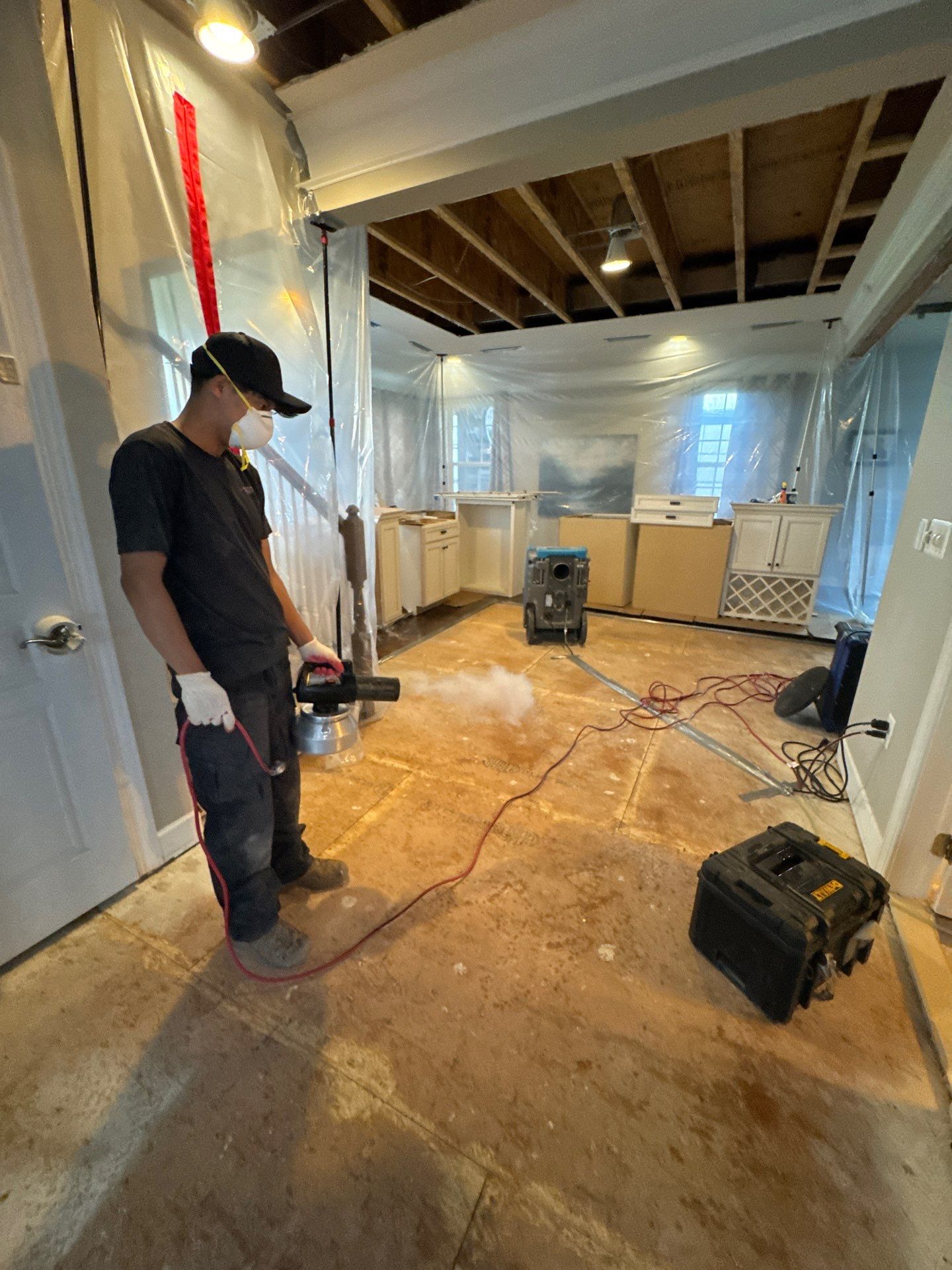 Containment barrier erected around mold remediation work area in Reston home.