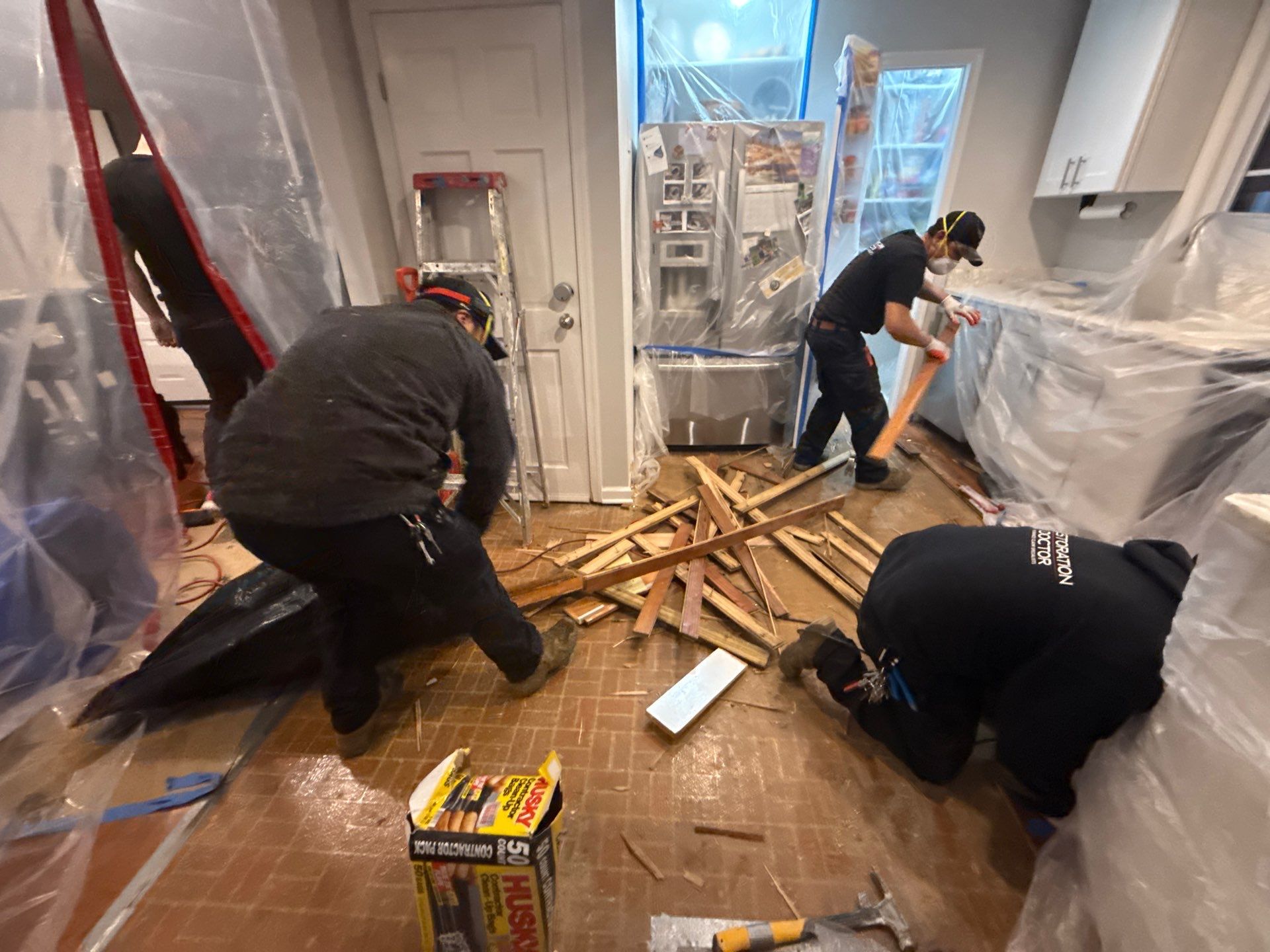 Contents protected and staged away from affected areas during the drying process.