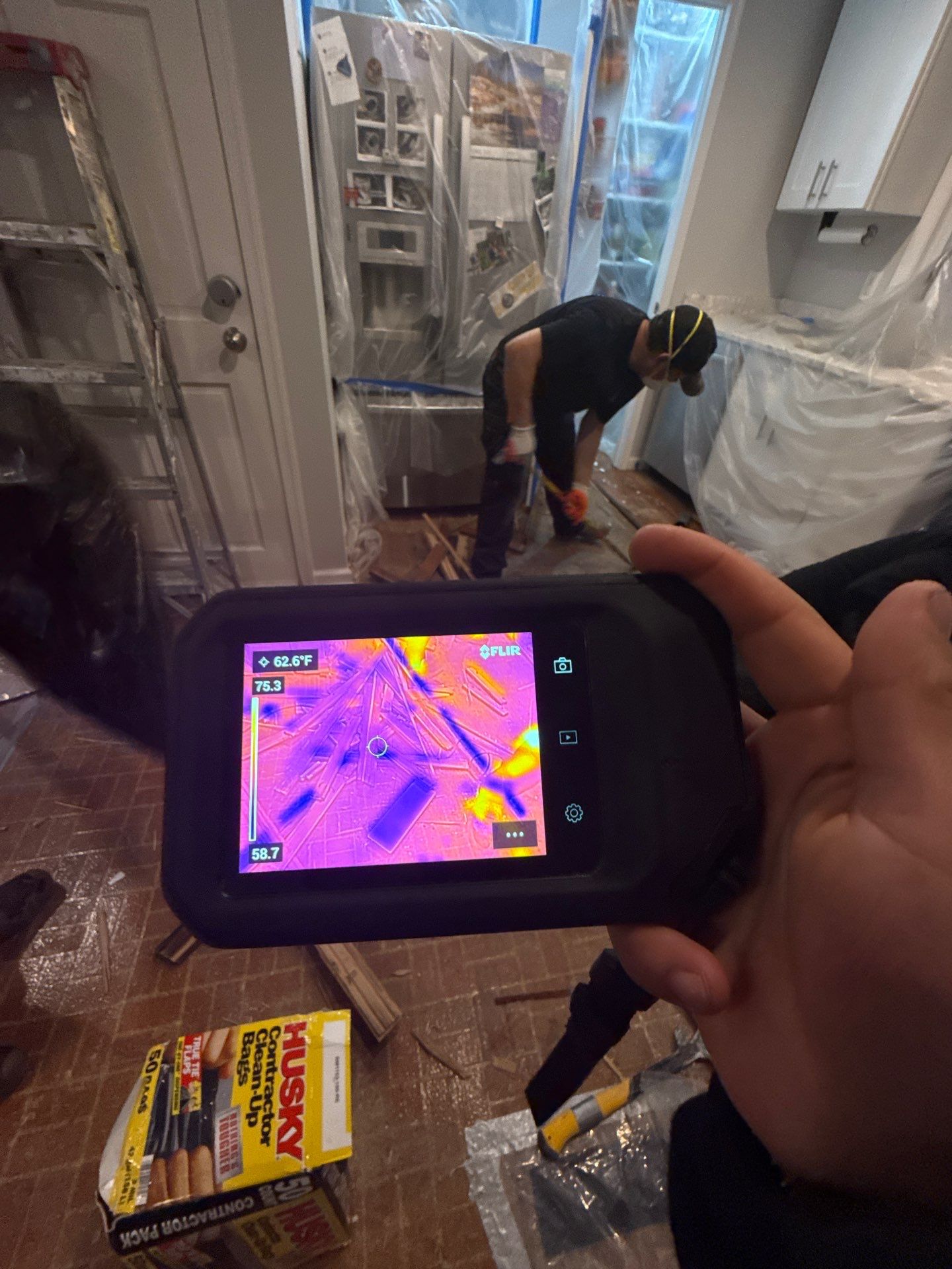 Final inspection confirming moisture levels normalized after water damage restoration completion.