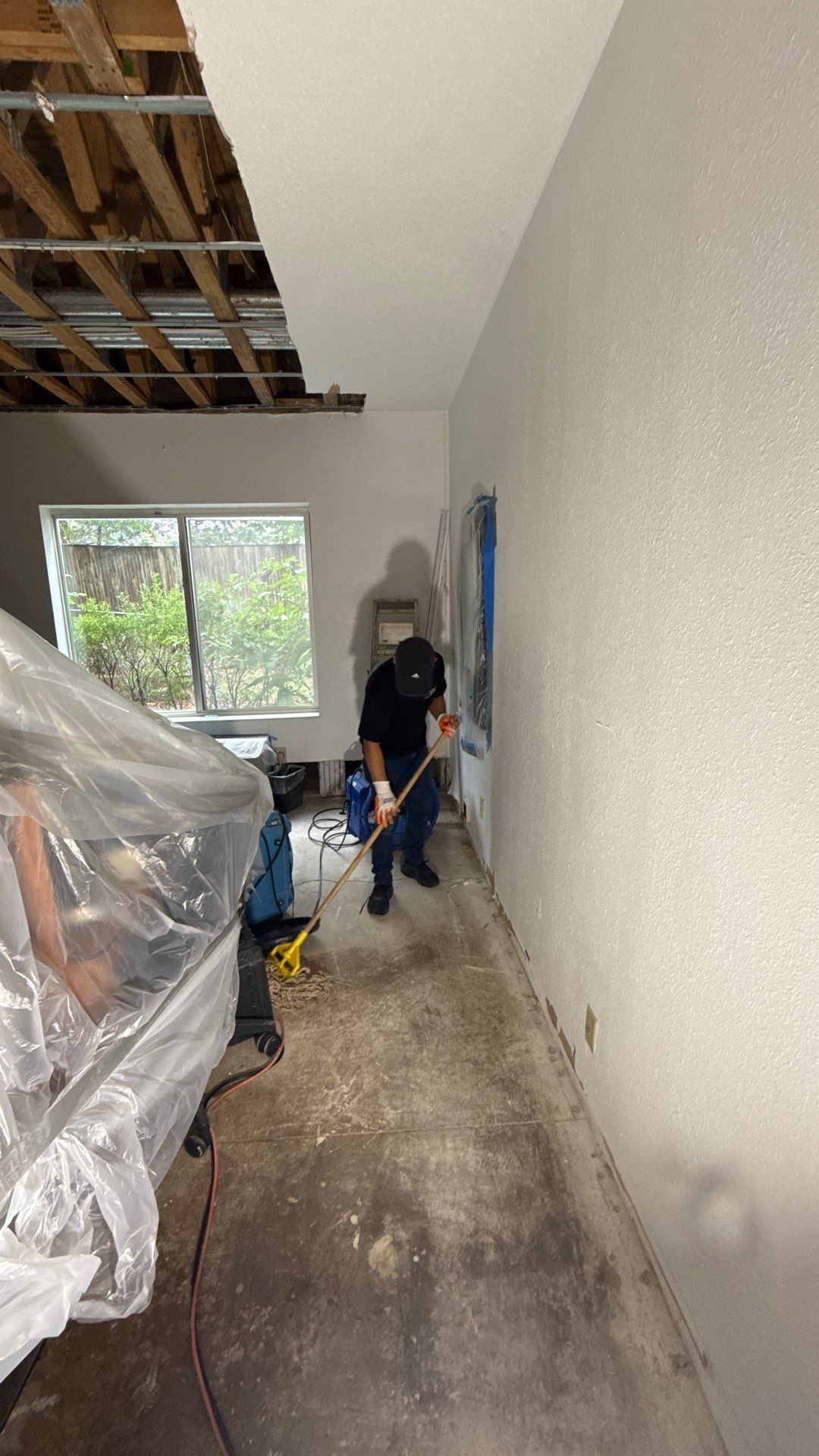 Baseboard removal and disposal, exposing framing for complete moisture assessment and drying.