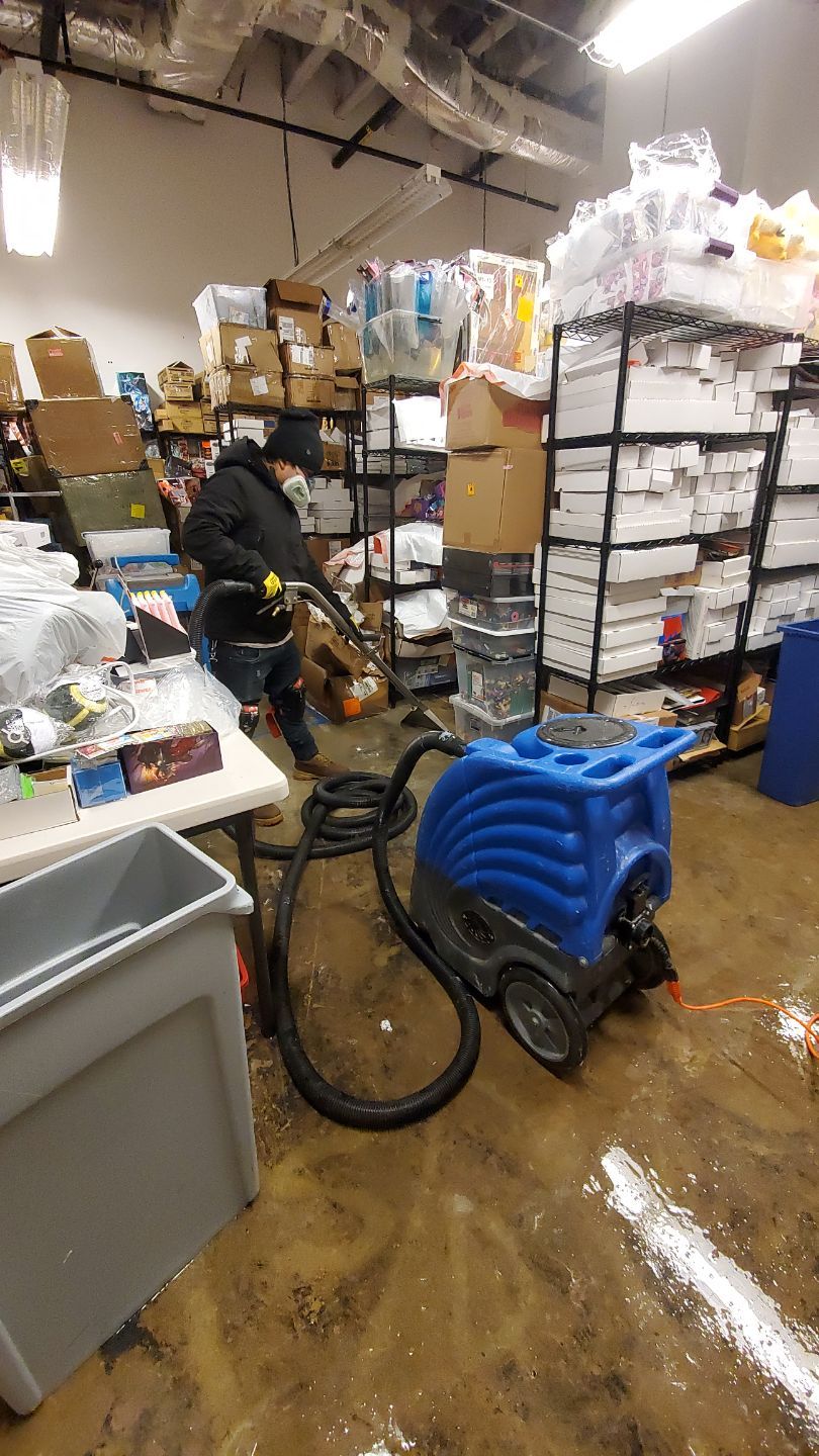 Structural drying in progress with air movers and moisture monitoring equipment deployed.