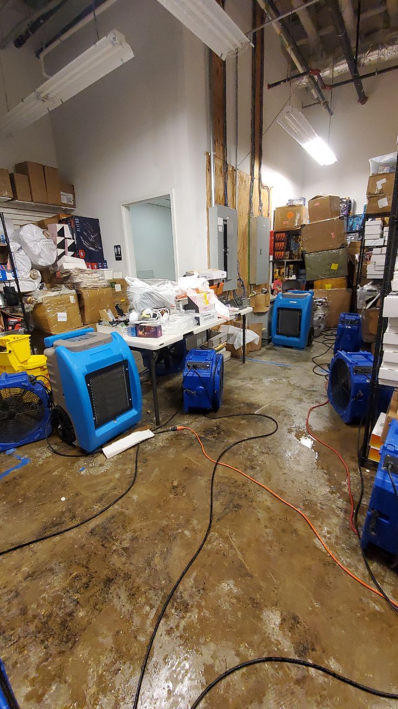 Continued dehumidification and air circulation during water damage restoration drying phase.