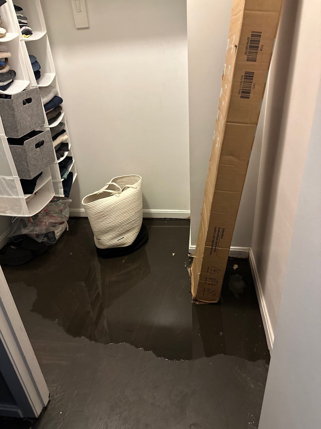Water extraction and dehumidification setup in Falls Church home during initial damage assessment.