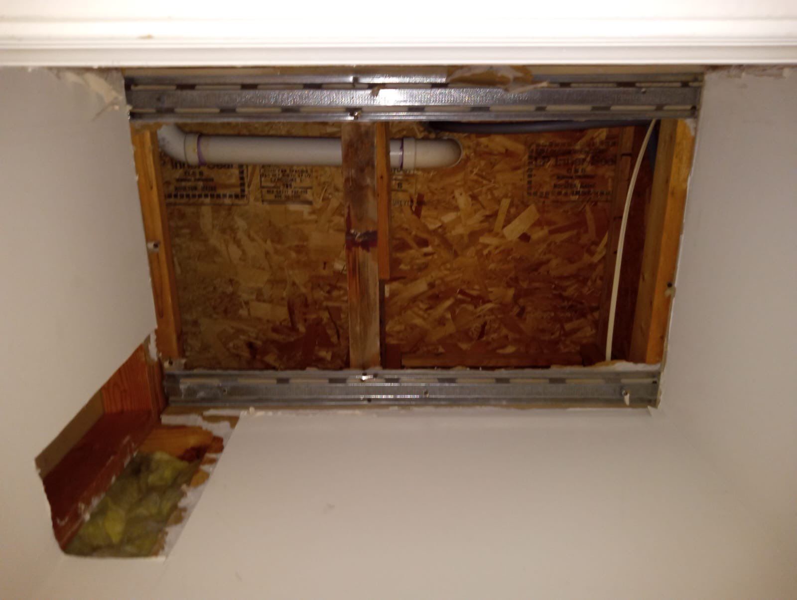 Repaired ceiling after water damage restoration in Alexandria, structural drying and dehumidification phase complete.