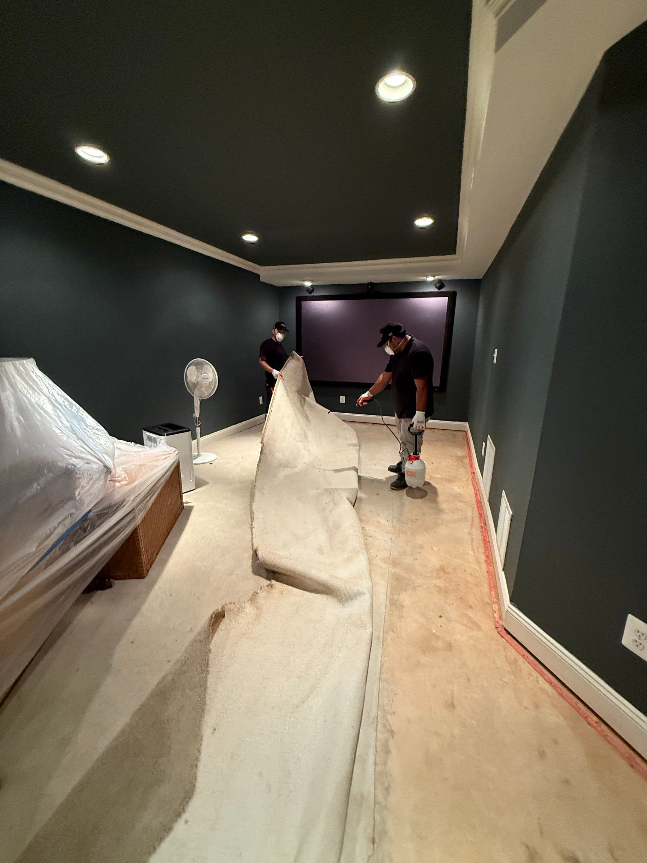 Final stages of water damage restoration showing cleared and dried surfaces.