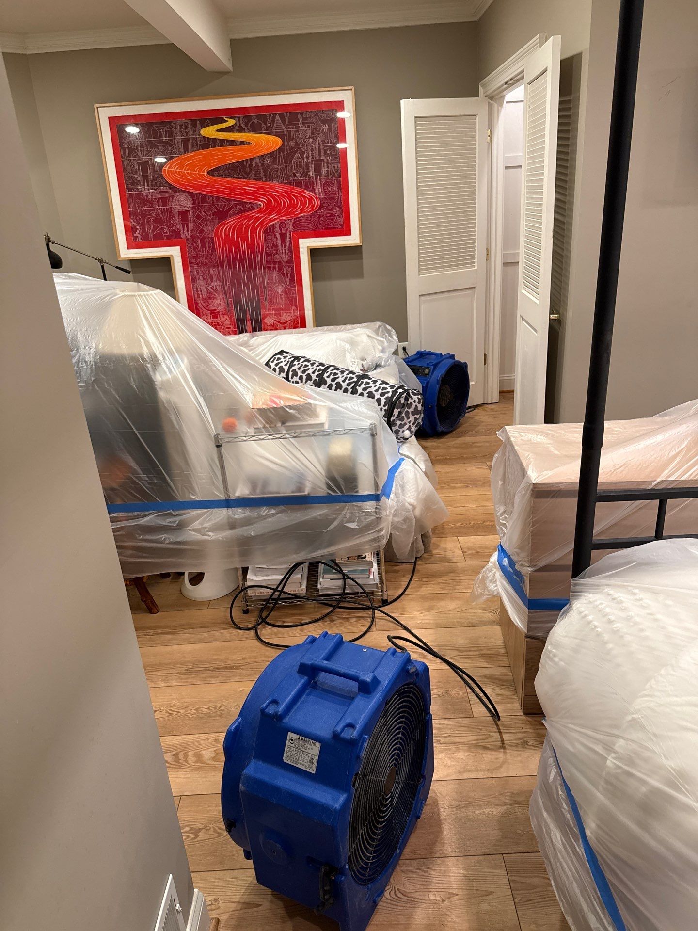 Carpet removal and subflooring inspection during Great Falls restoration work.