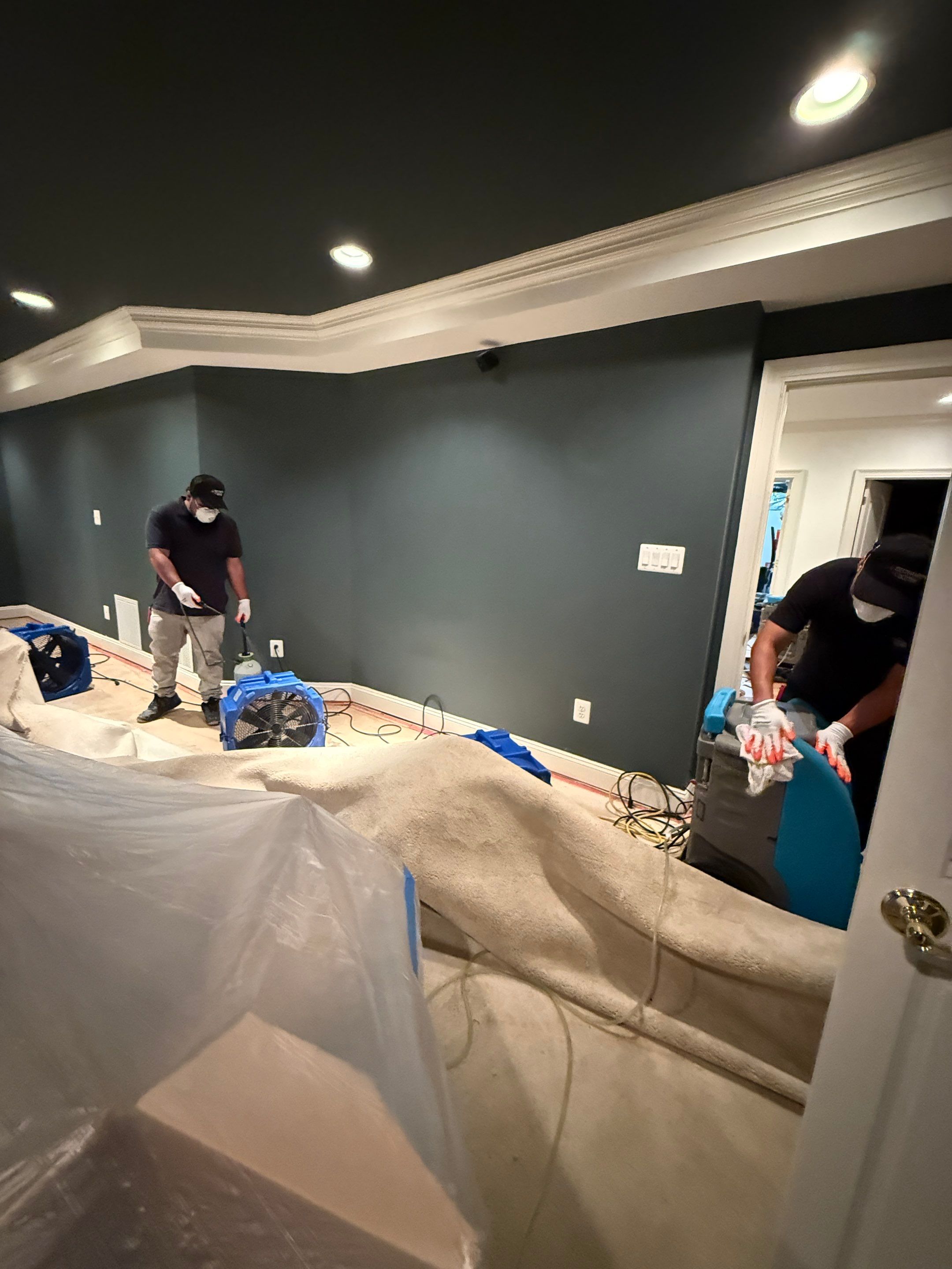 Standing water extraction underway in Great Falls home during water damage restoration.