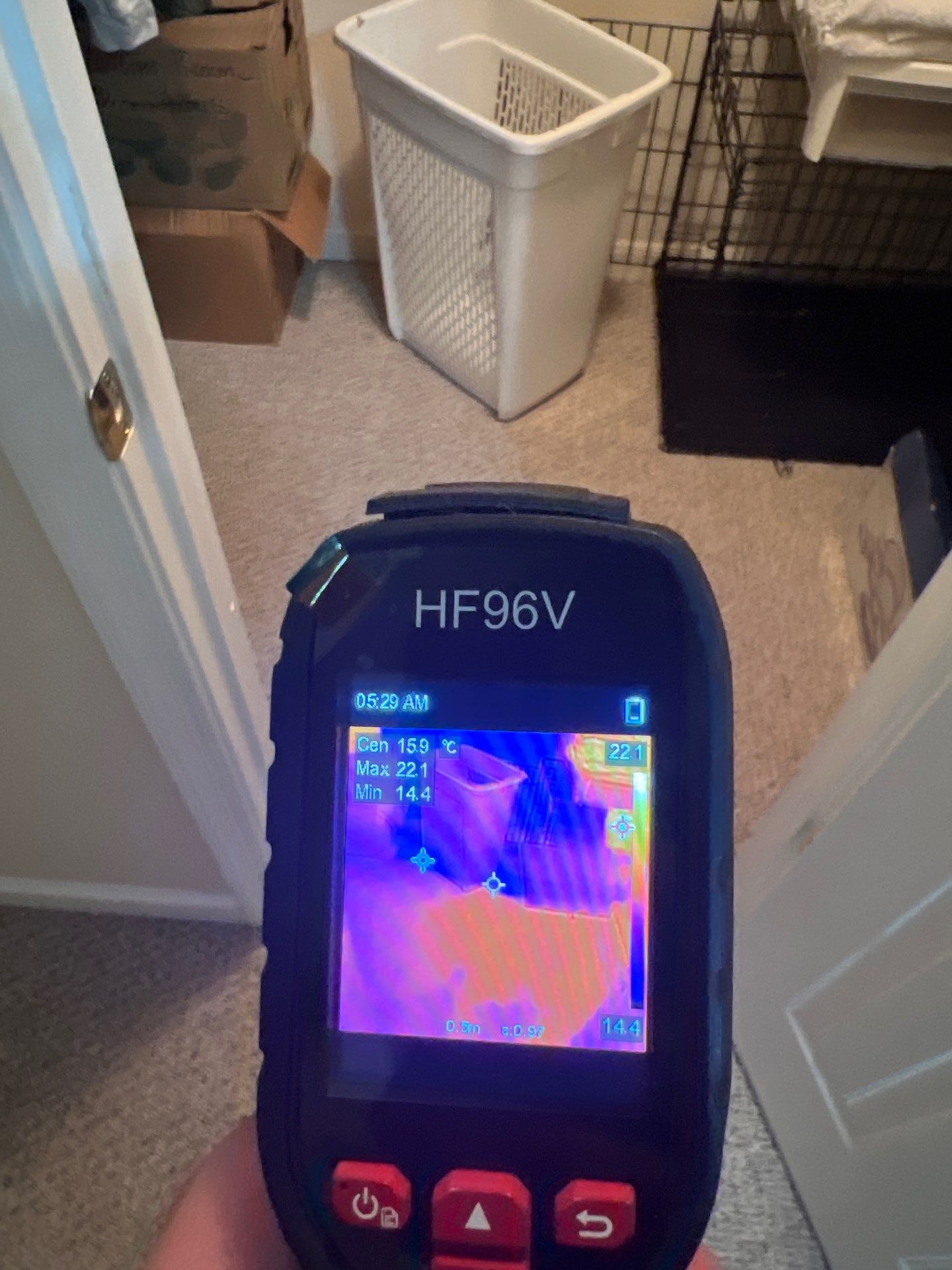 Mid-stage moisture monitoring with thermal camera confirming drying progress in wall and floor assemblies.