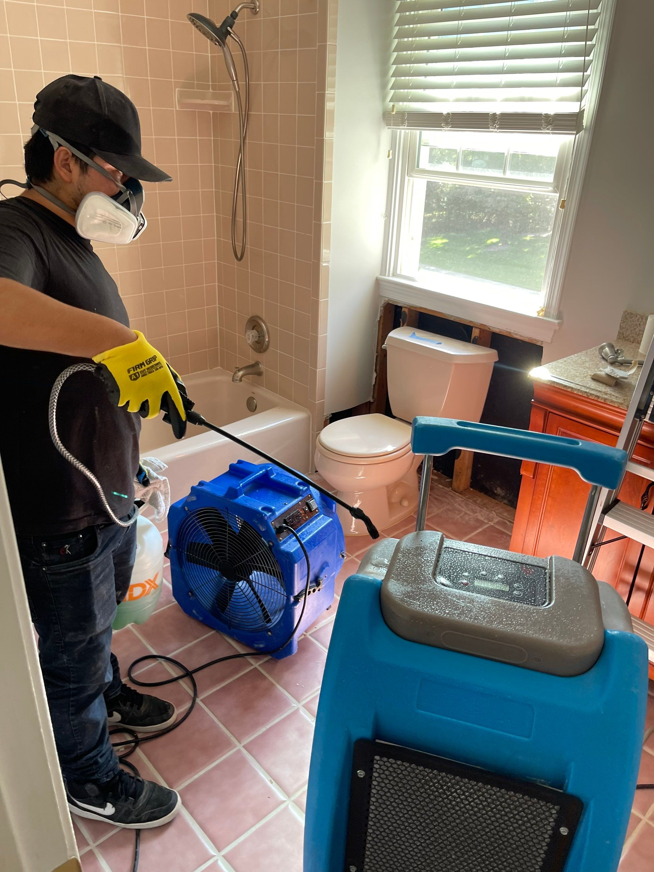 Dehumidifier and air movers positioned for structural drying during Vienna water damage recovery.