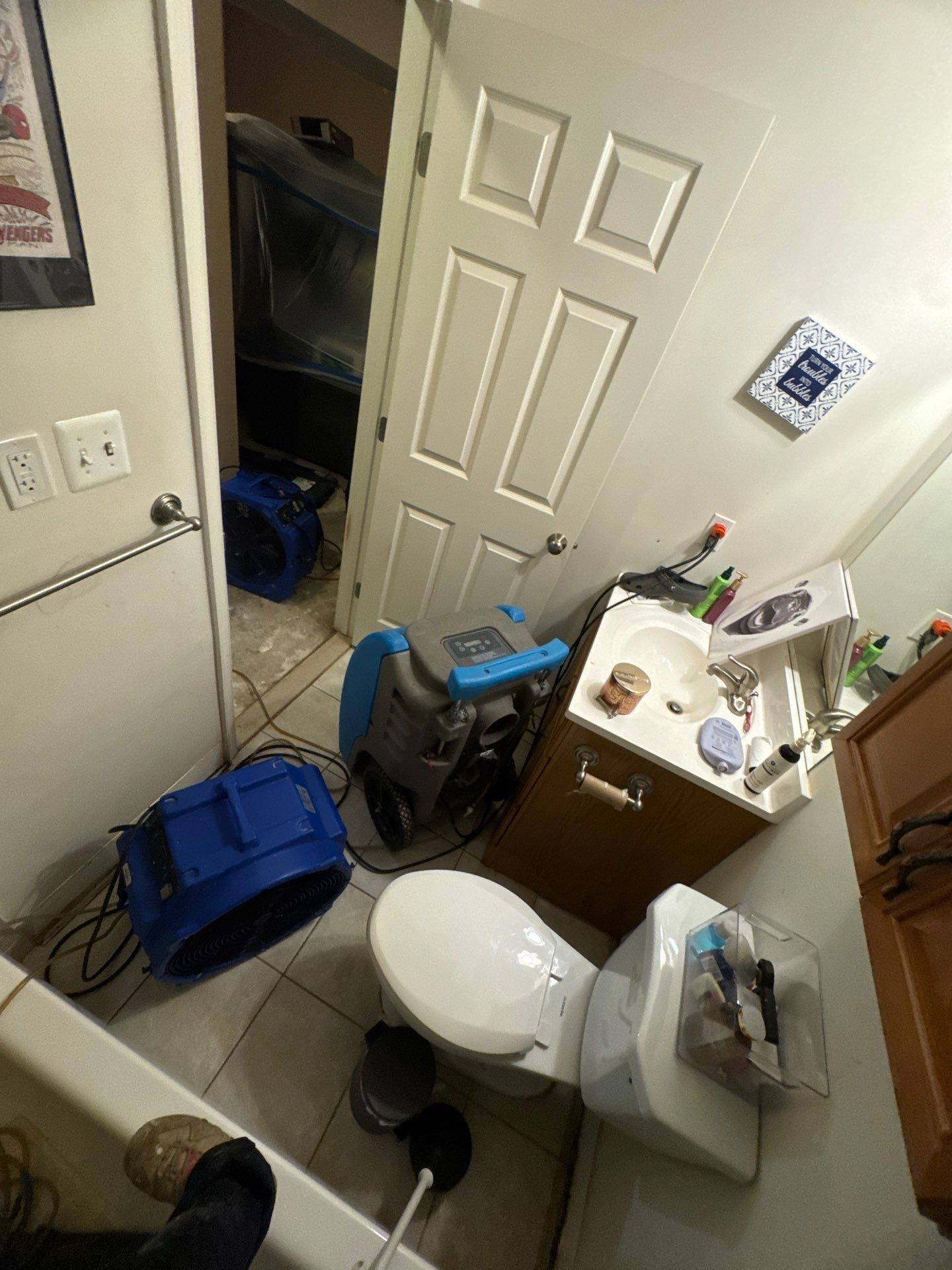 Drying equipment positioned throughout affected areas during water damage restoration.