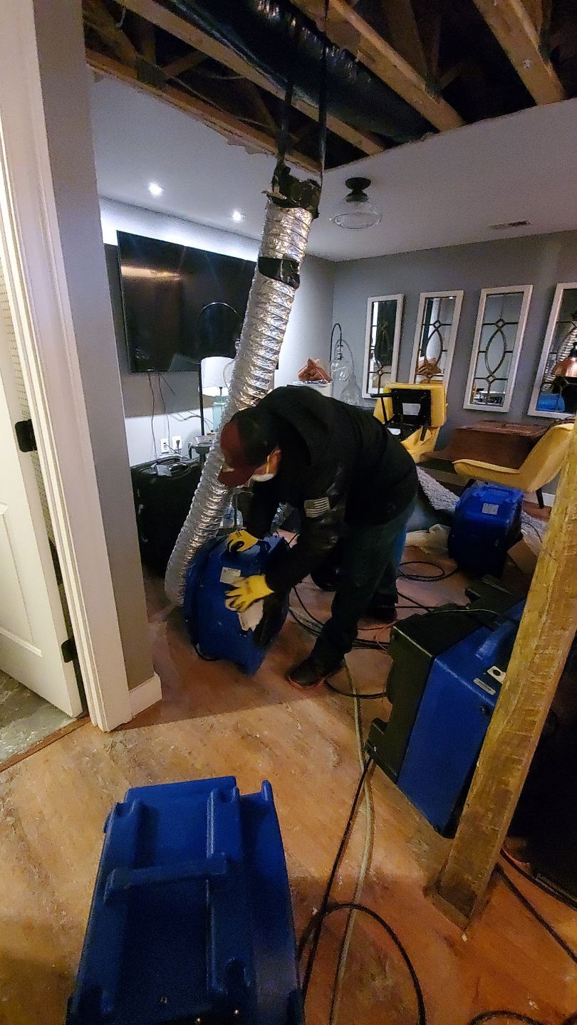 Final ceiling repair and restoration complete, with drying equipment removed and room returned to service.