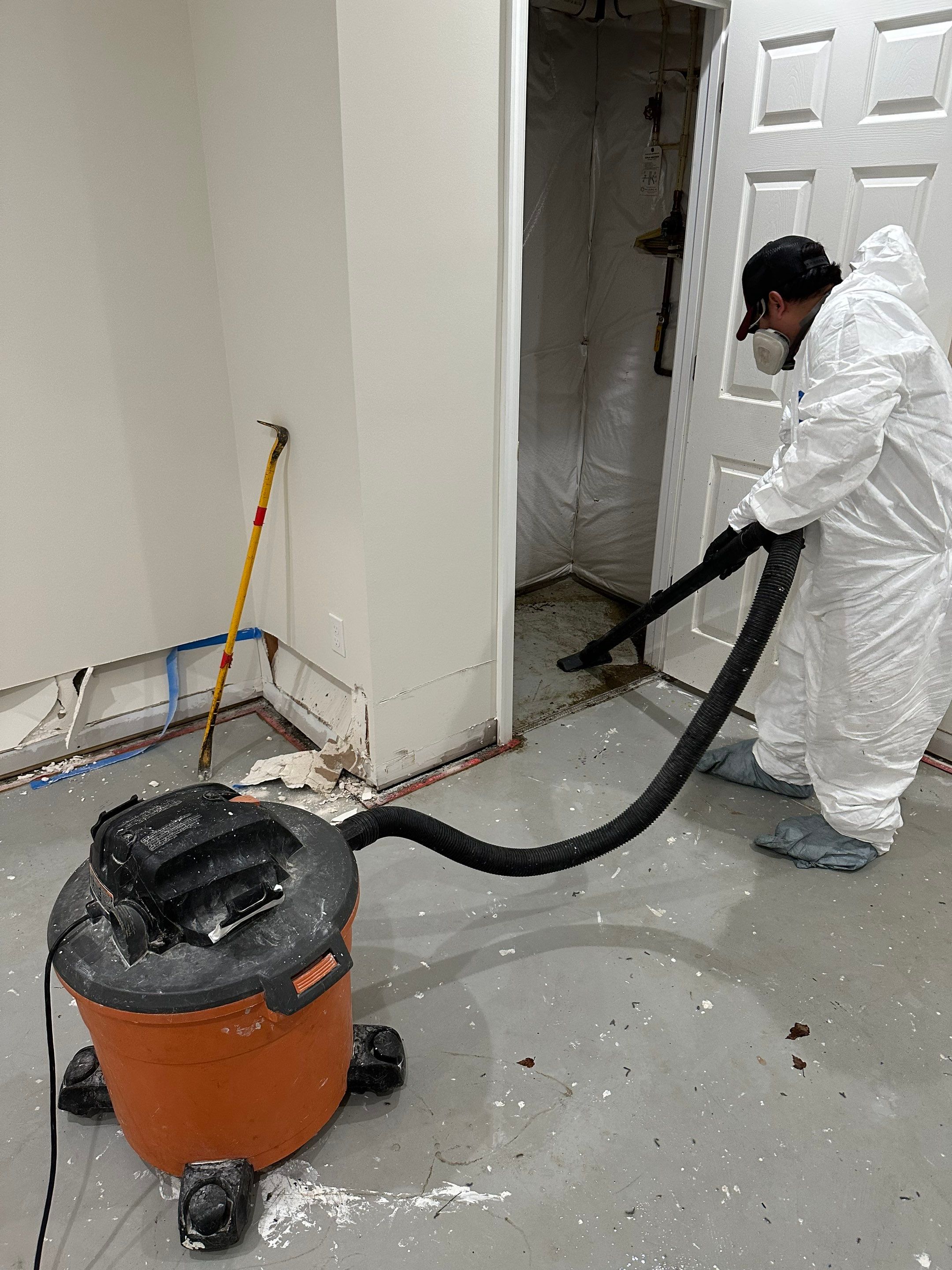 Thermal imaging identifies moisture patterns in affected wall cavity during drying phase.