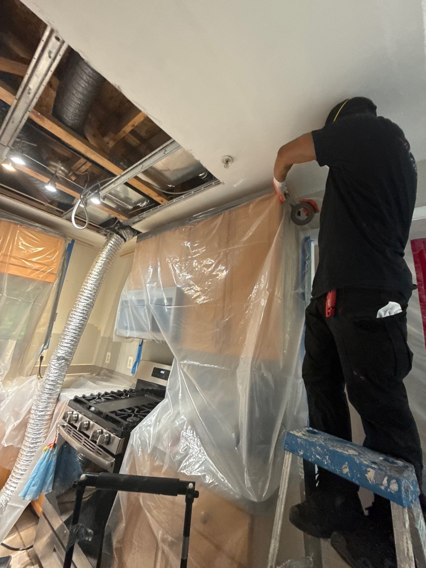 Standing water removal in progress during Fairfax water damage restoration.