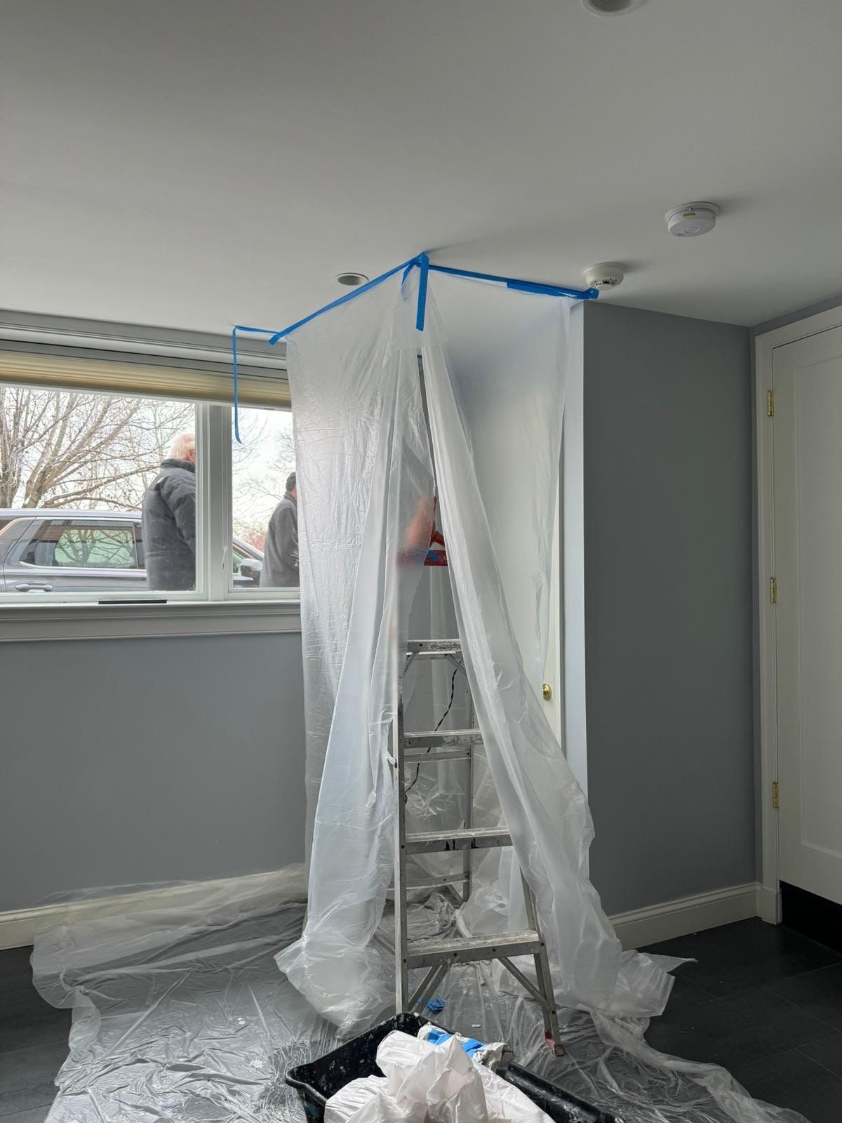 Mid-stage drying showing equipment placement and moisture extraction from structural cavities.