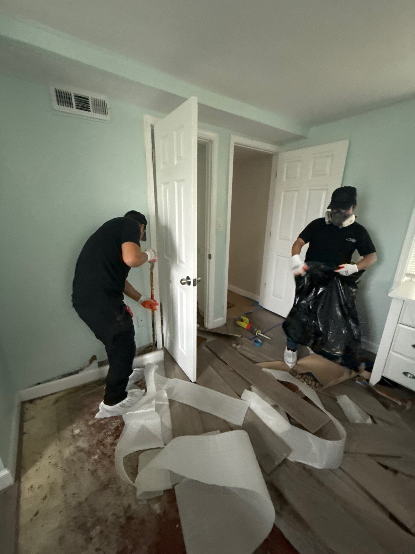 Containment barrier and negative air setup during mold remediation work in Arlington.