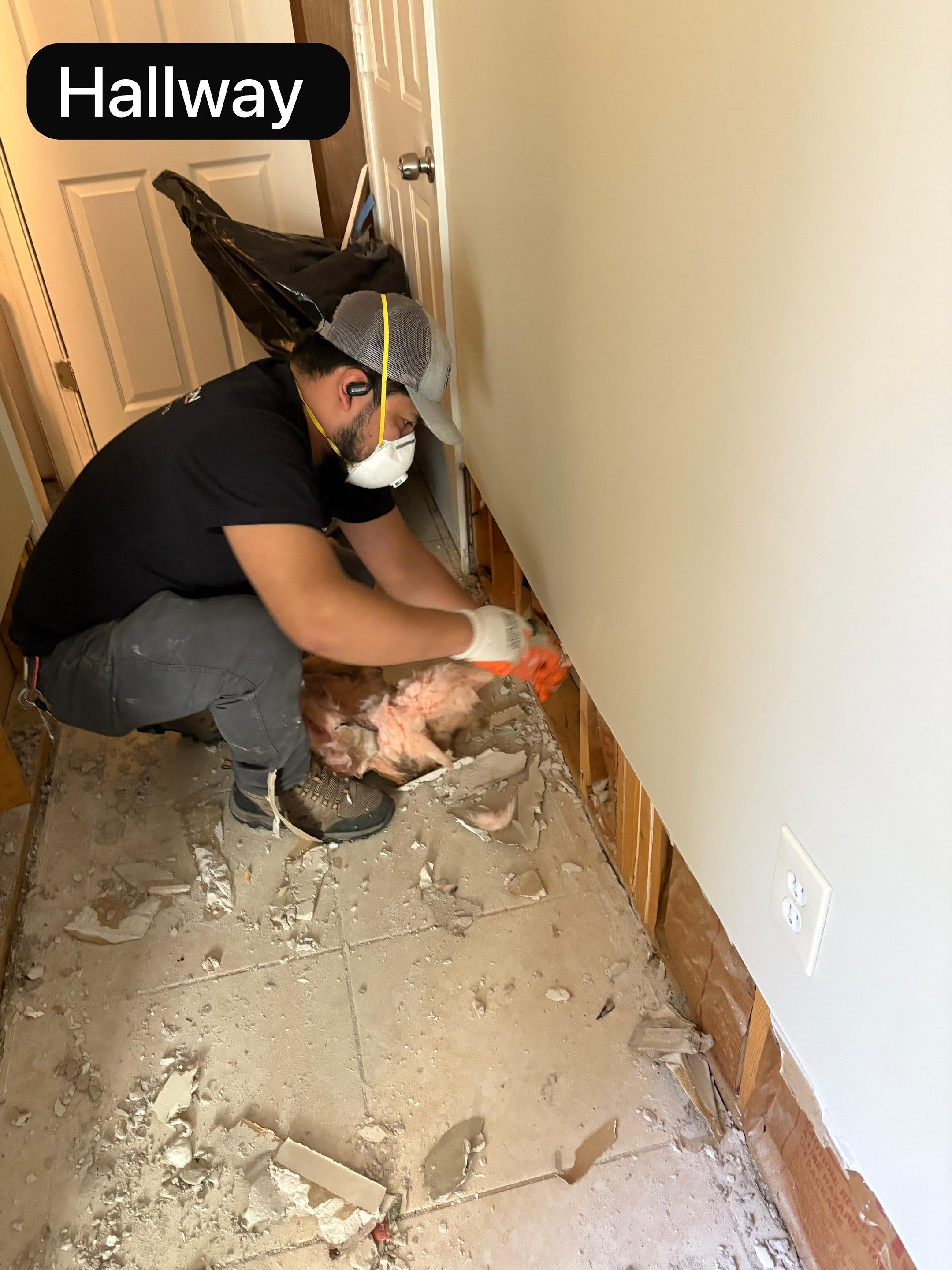 Baseboard removal complete; framing and substrate prepared for final drying and remediation closure.