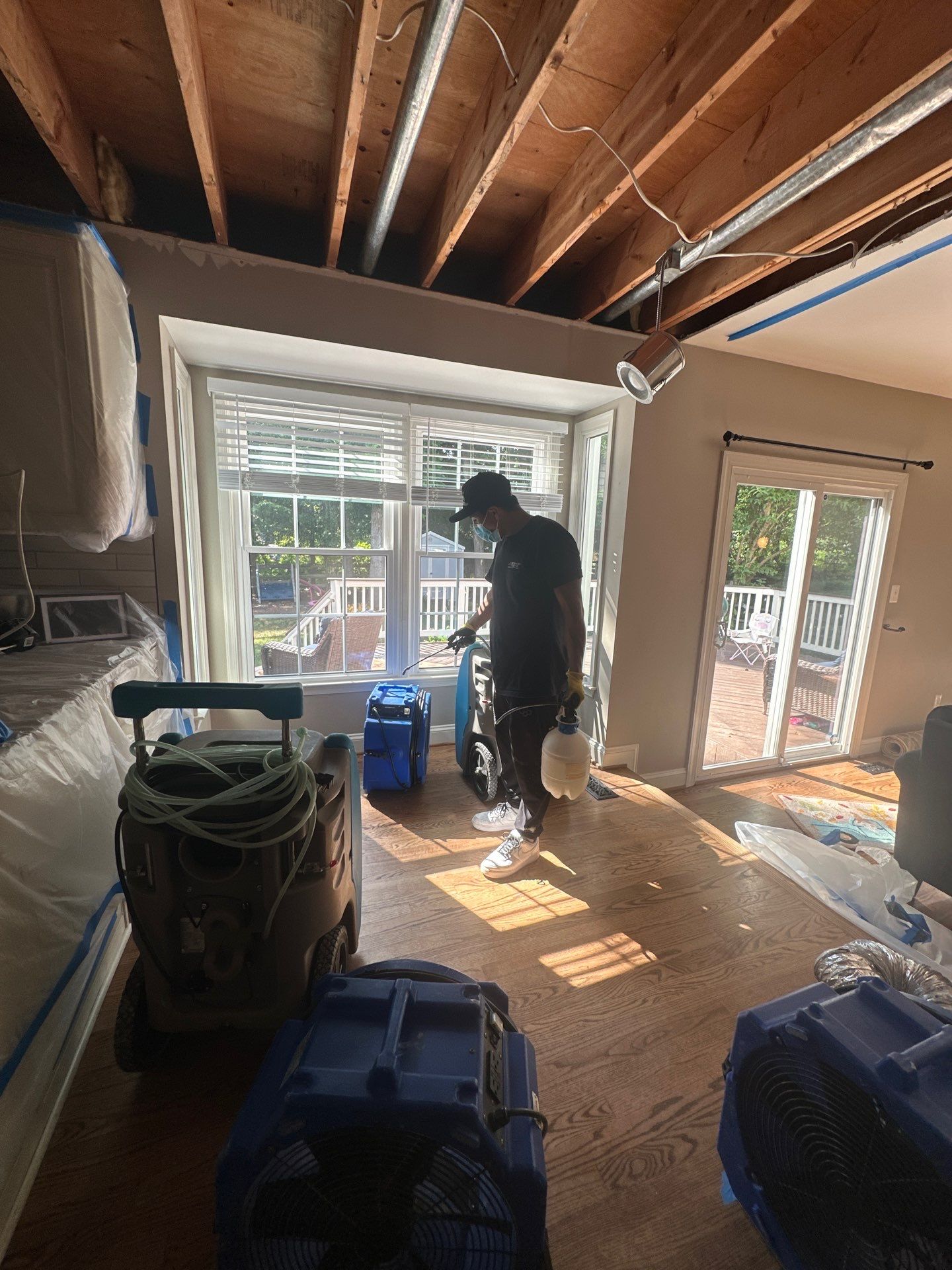Continued dehumidification process with equipment monitoring moisture levels in Burke water damage restoration.