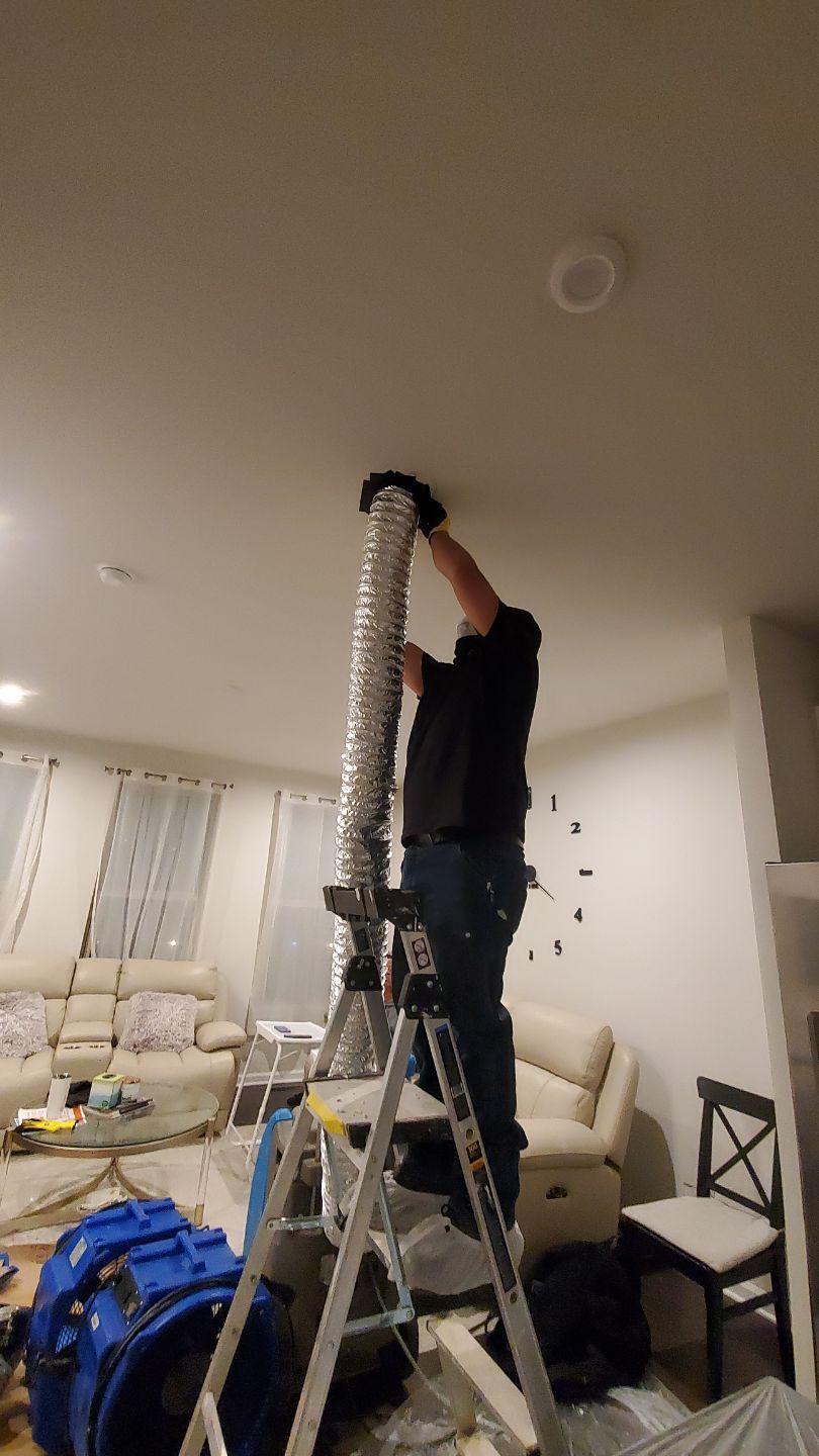 Final-stage water damage restoration with containment and dehumidification systems completing structural dry-out.