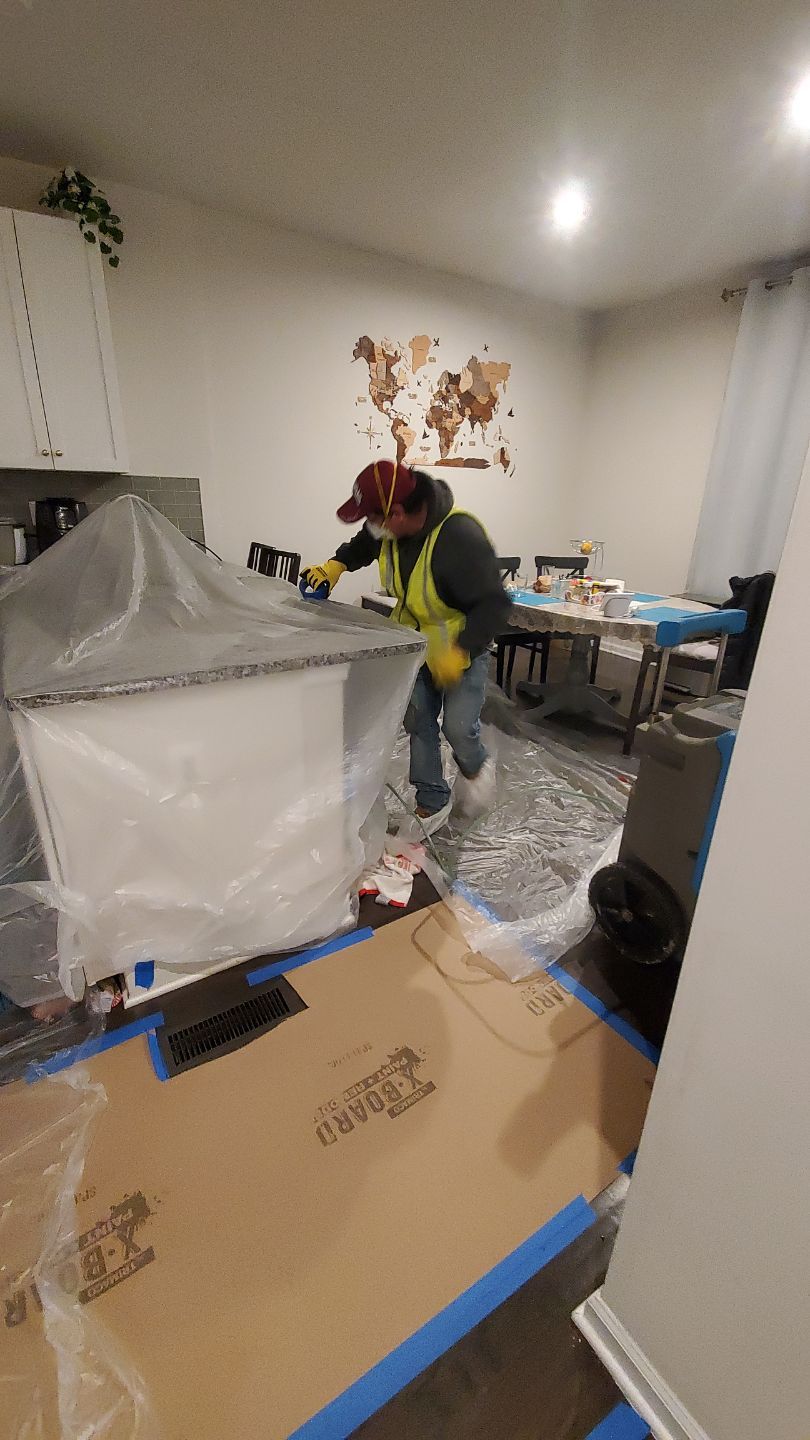 Structural drying in progress with containment and dehumidifiers managing moisture removal.